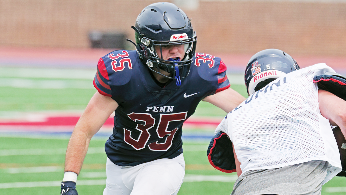 Gavin Griswold approaches a offense player and prepares to engage.