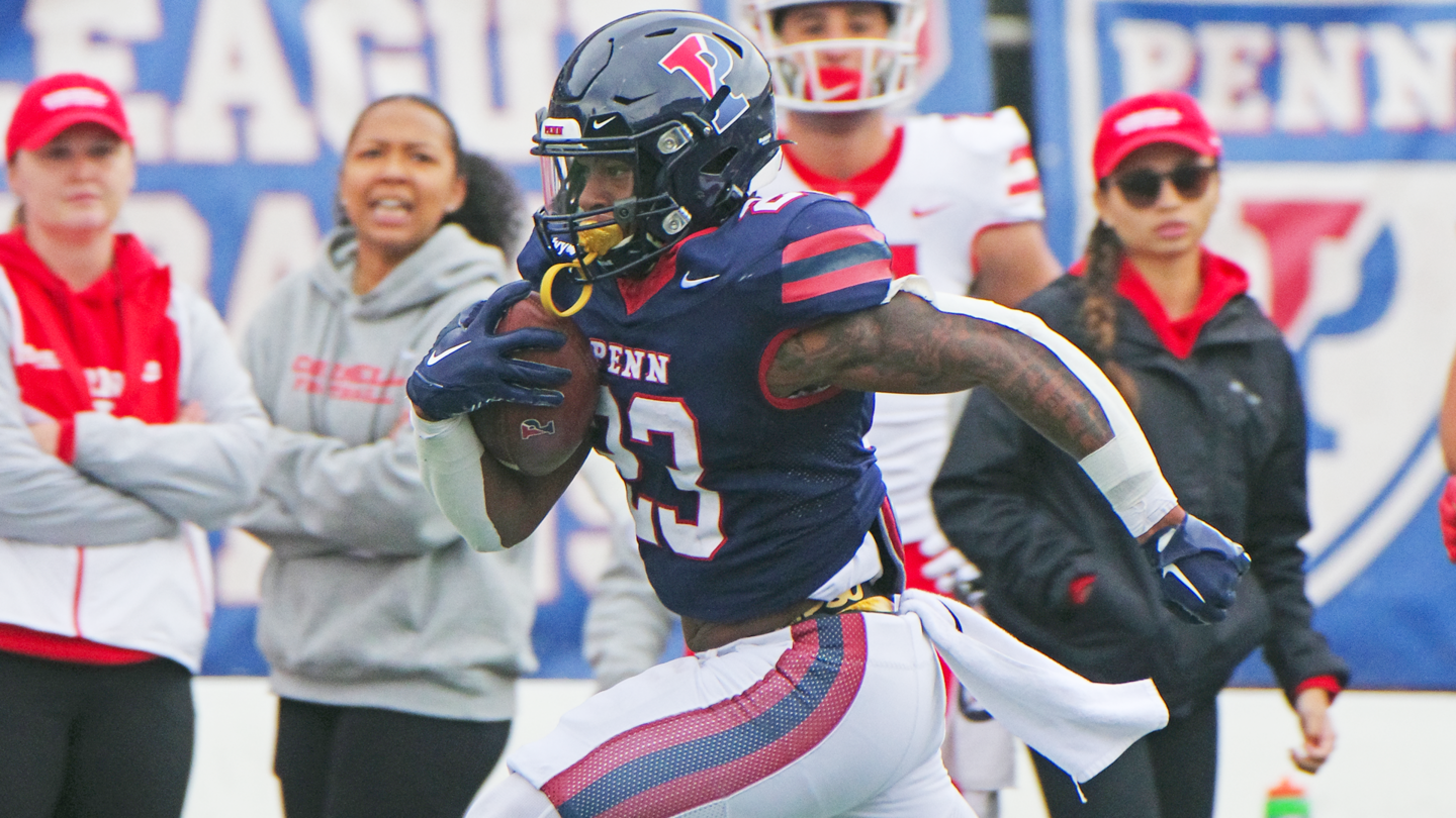 Malachi Hosley races down the field with the ball during a long run against Cornell.