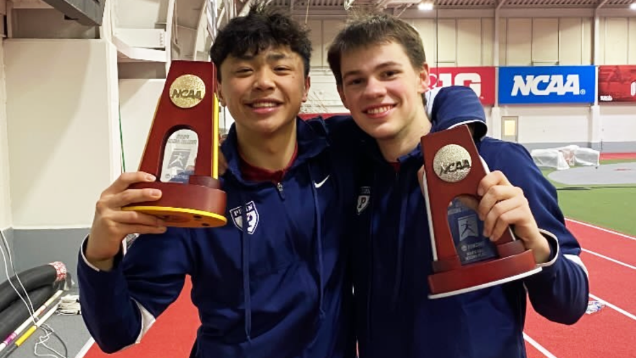 Bryce Louie and Blake Broszus hold up their first place and second place awards.