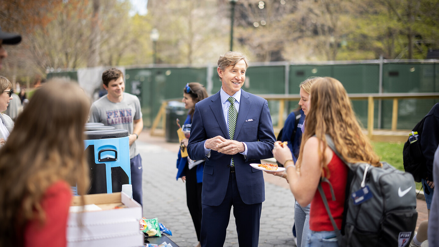 Interim President Jameson chats with students on Locust Walk.
