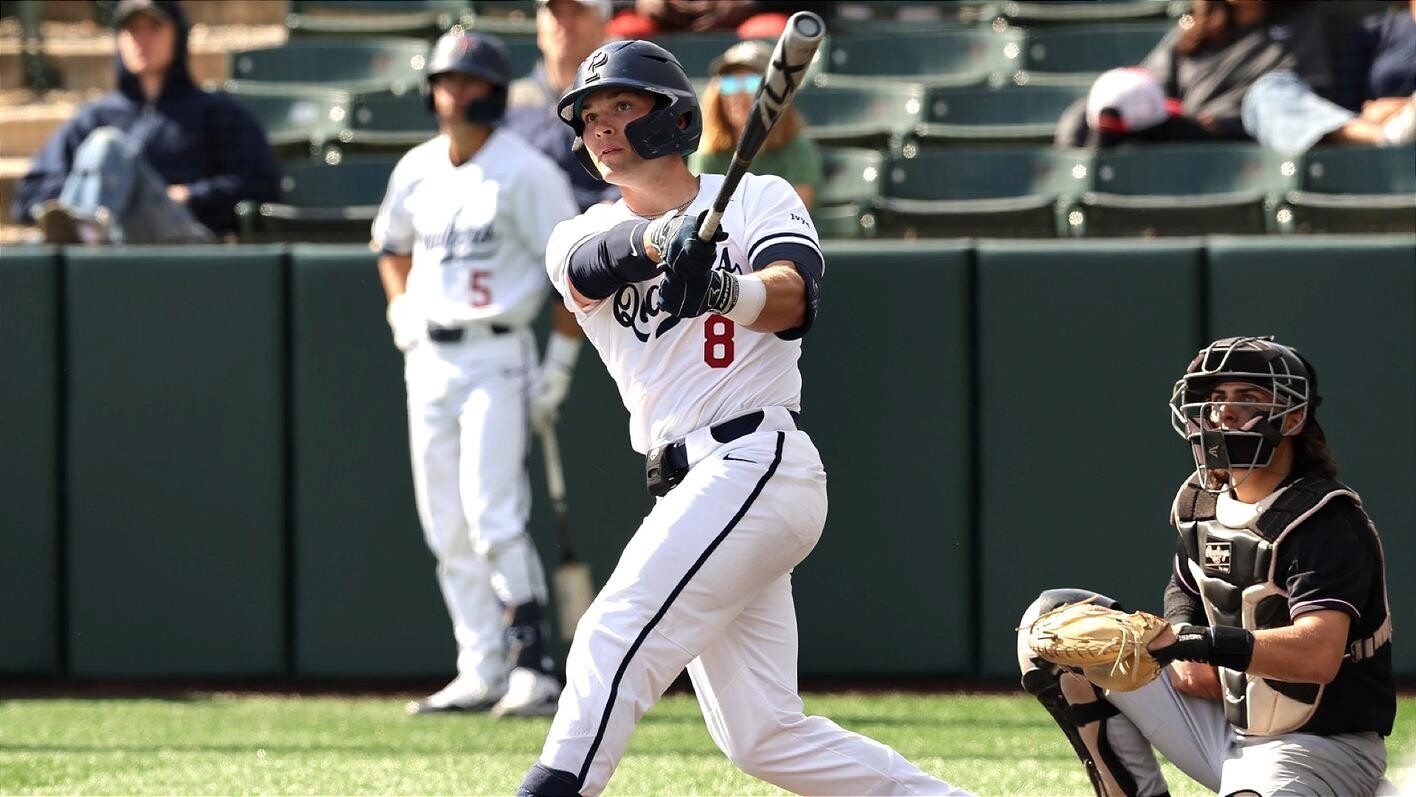 Wyatt Henseler looks at a pitch in the batter's box after a swing.