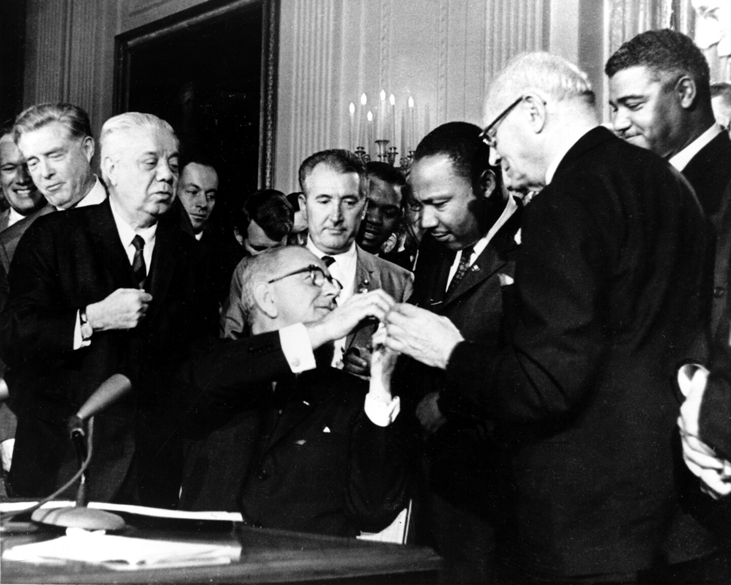 president johnson with martin luther king, jr signing civil rights act