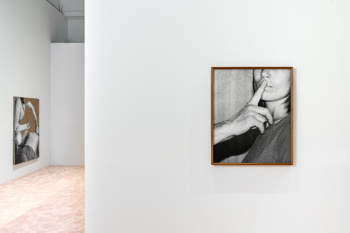 Photo portrait in foreground of gallery. 
