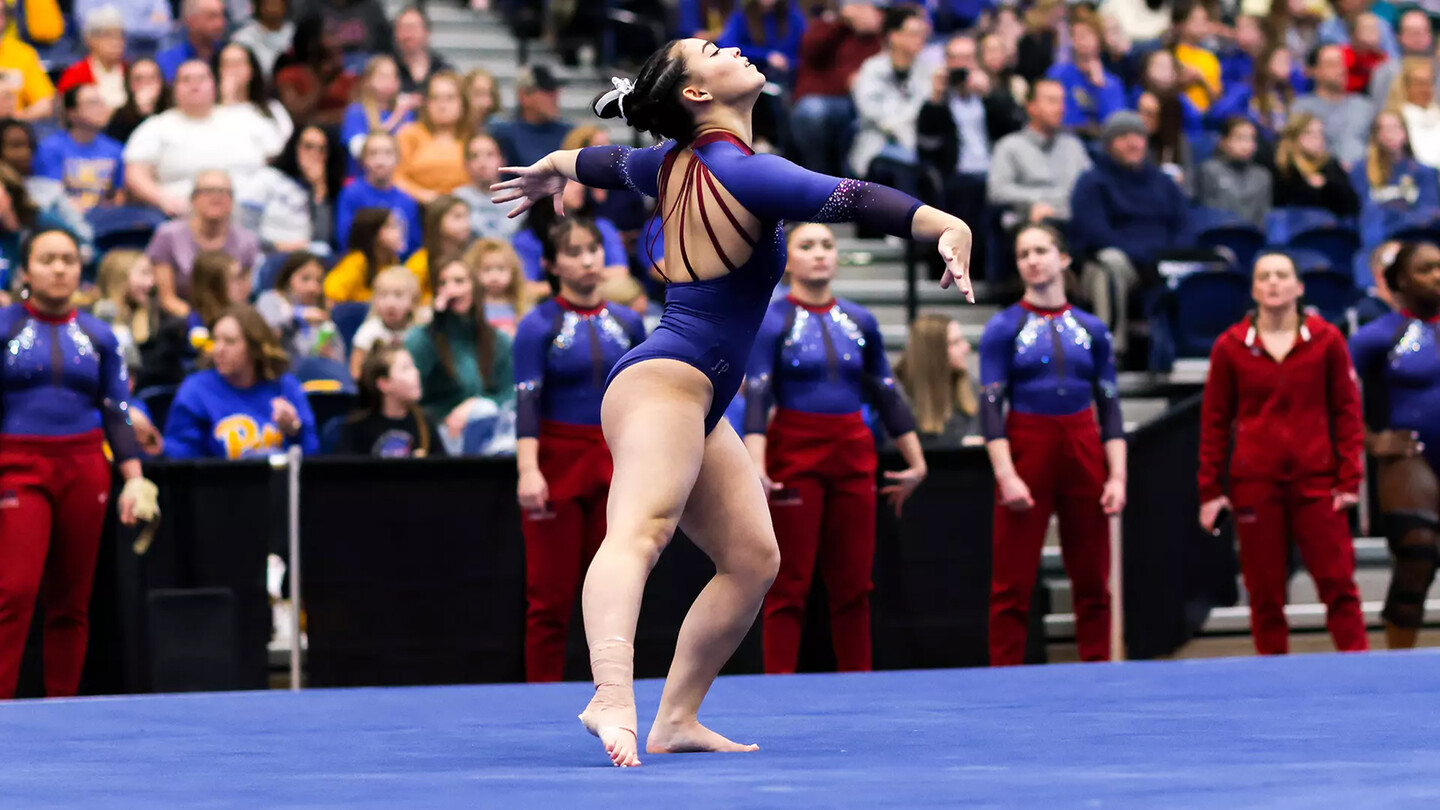 Carly Oniki performs on the mat during a competition.