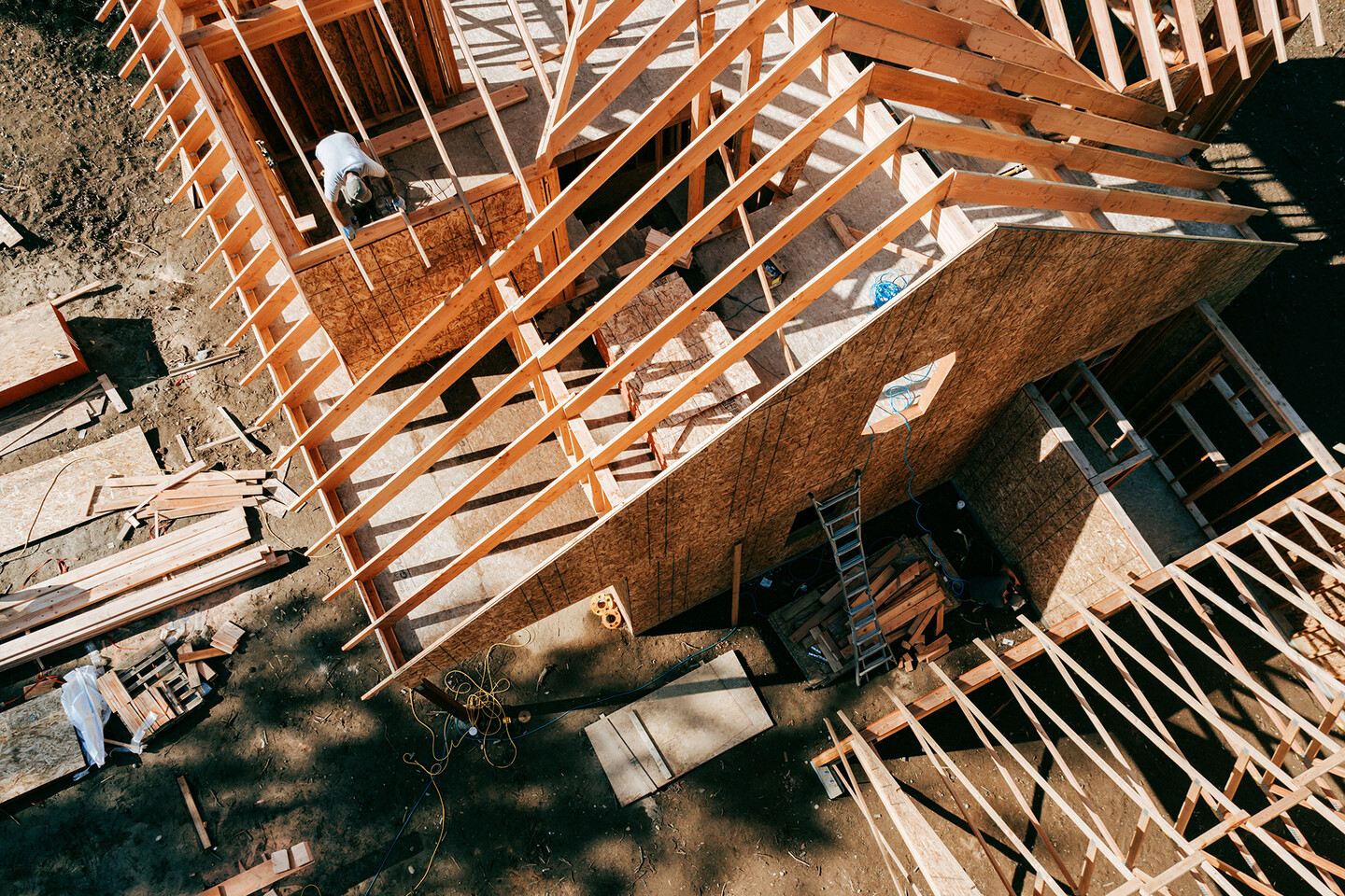 A roof and house under construction, aerial view.