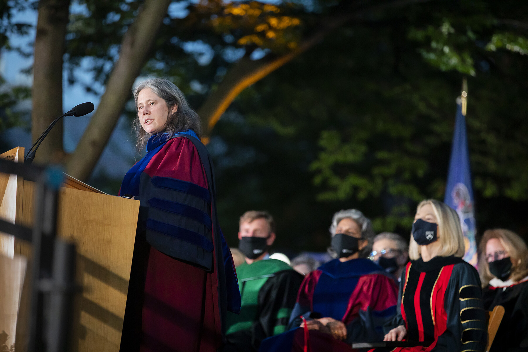 Beth Winkelstein at the podium addressing the crowd during Convocation.