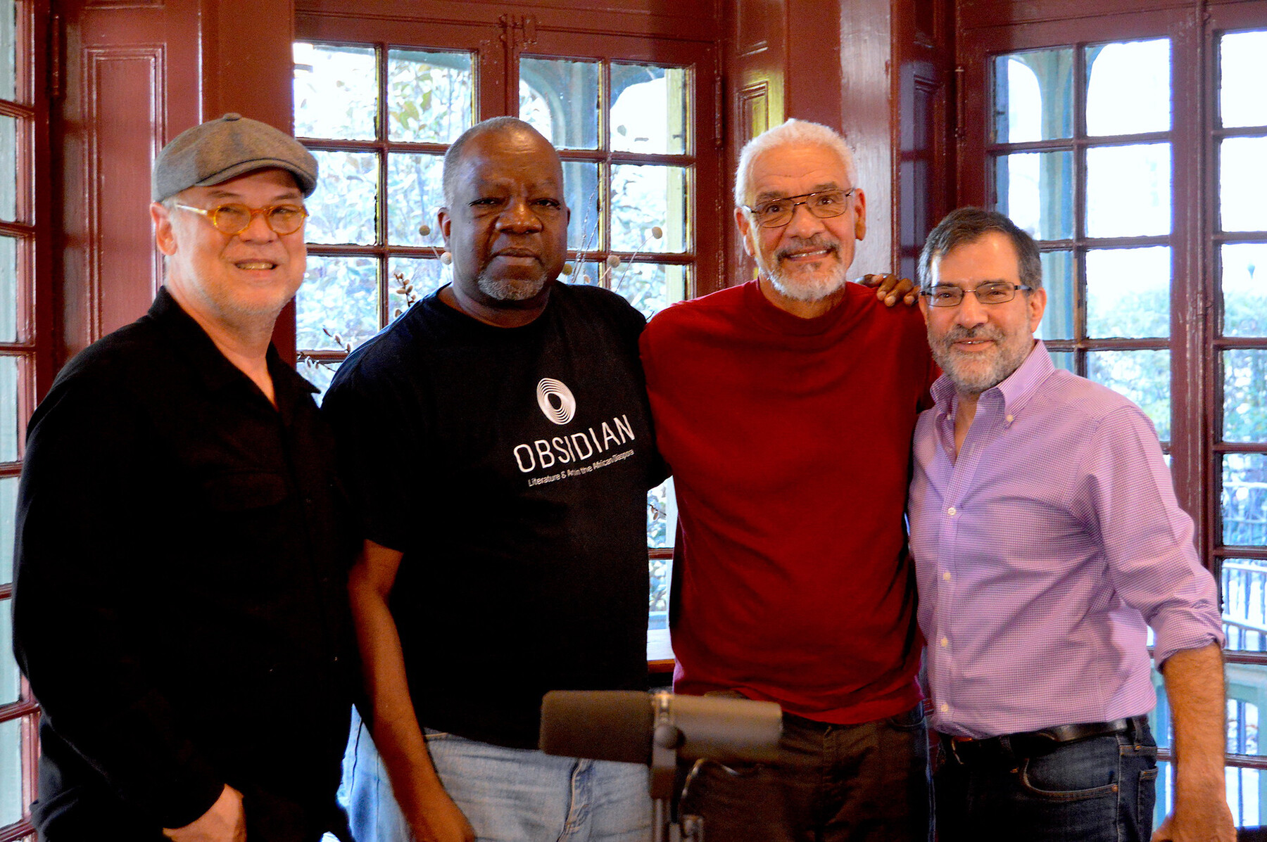 Al Filreis and three people standing in the the Kelly Writers House