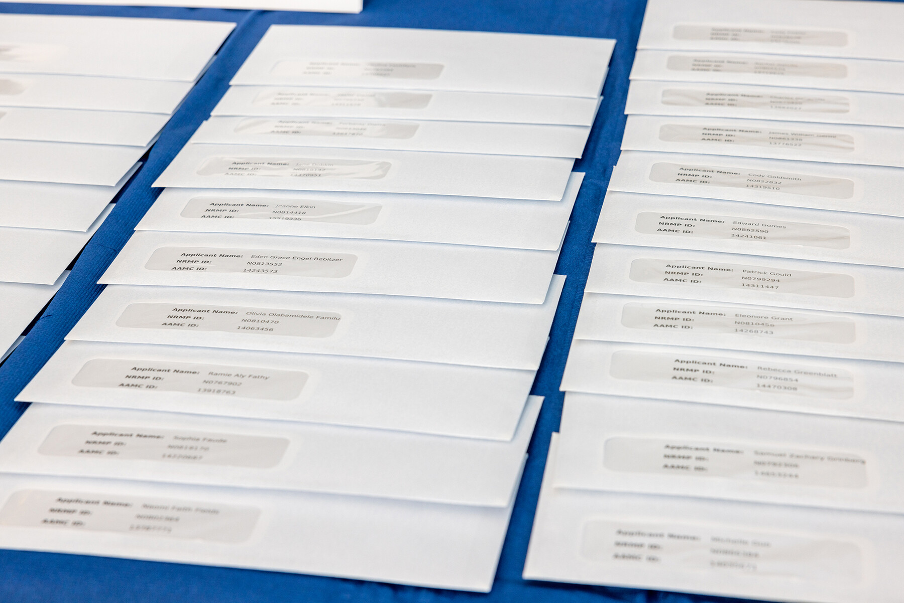 Rows of Match Day envelopes on a table.