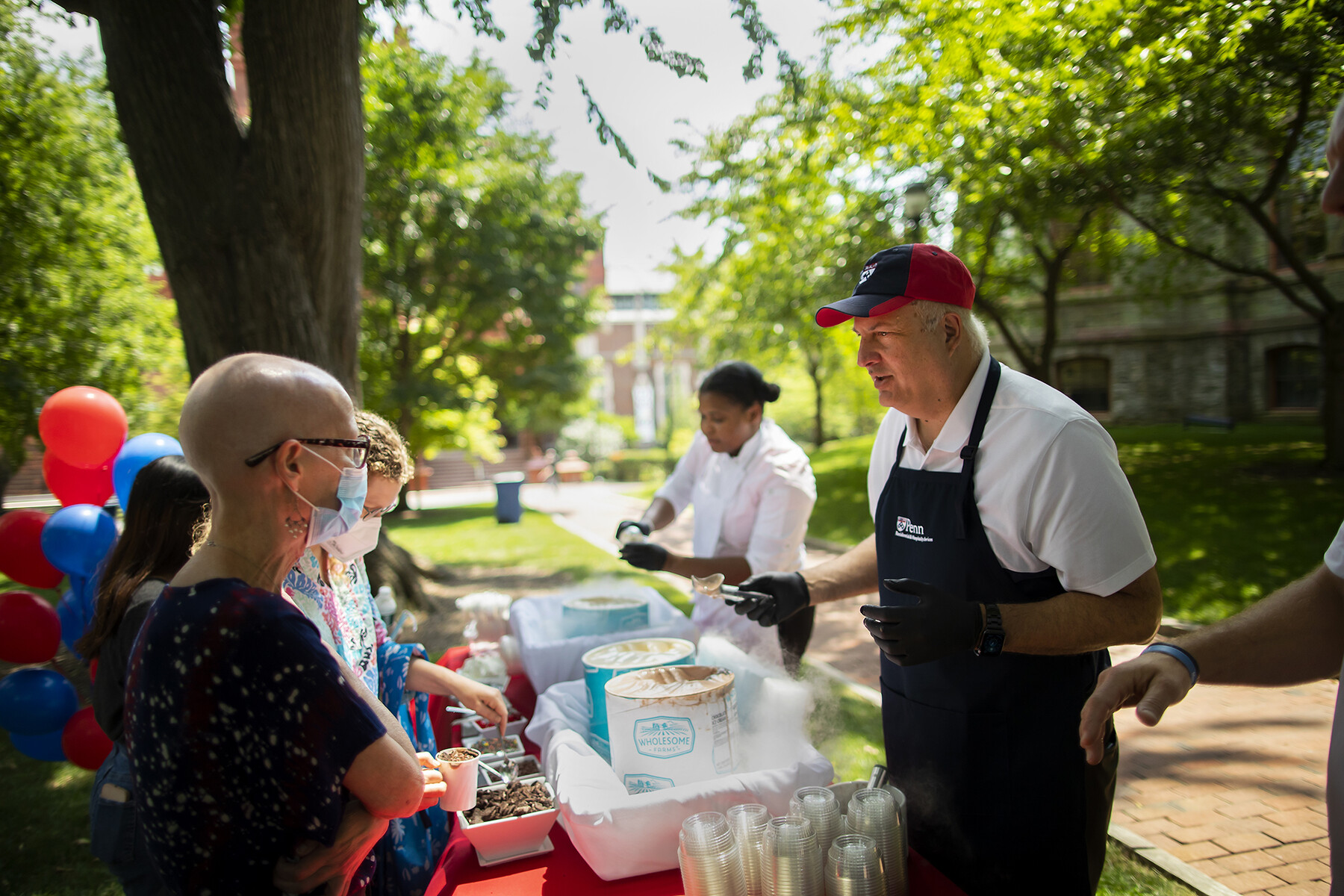 Craig Carnaroli scoops ice cream on College Green.
