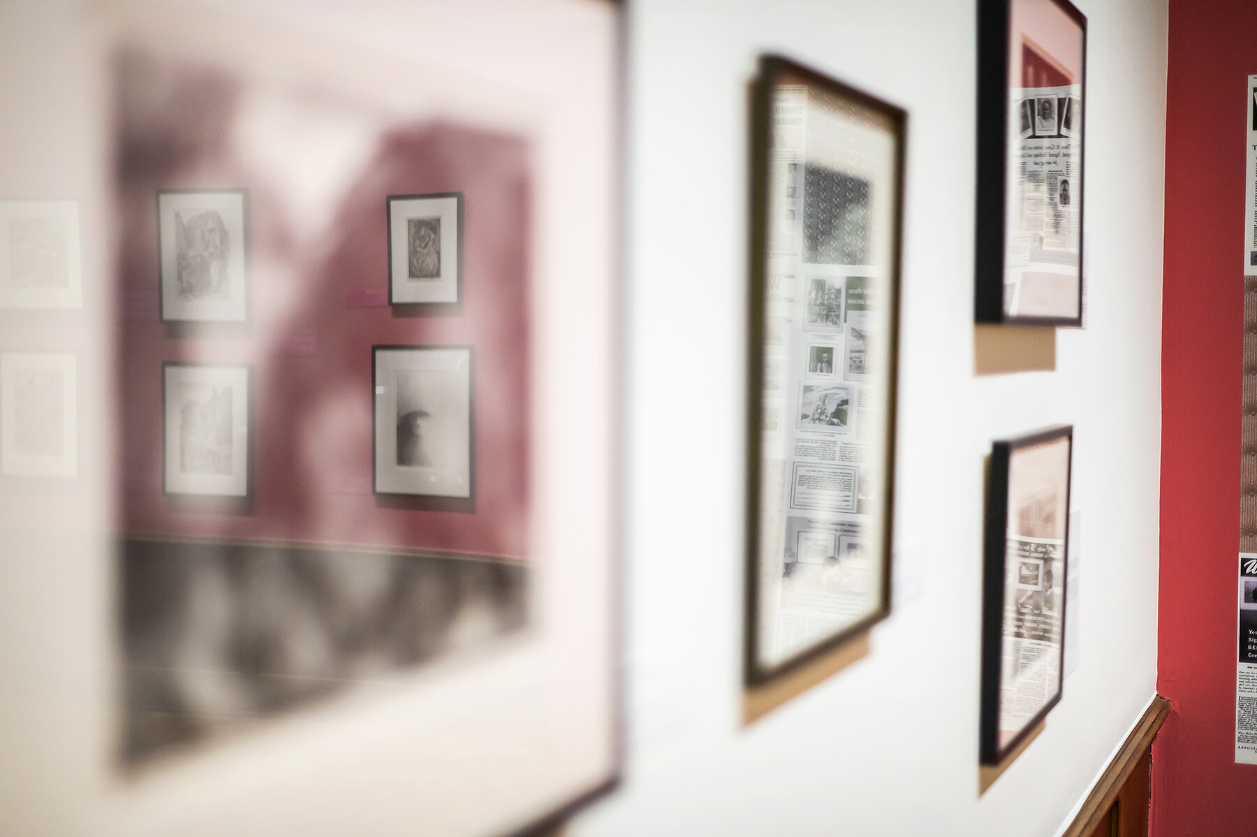 Four artworks on the wall at Arthur Ross Gallery.