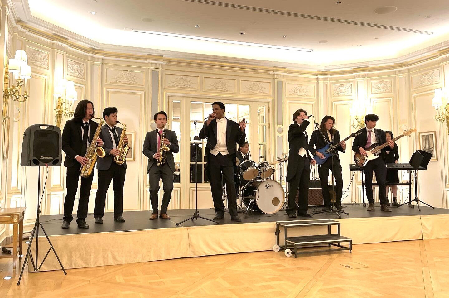 Penn Glee Club performing on stage in Paris.
