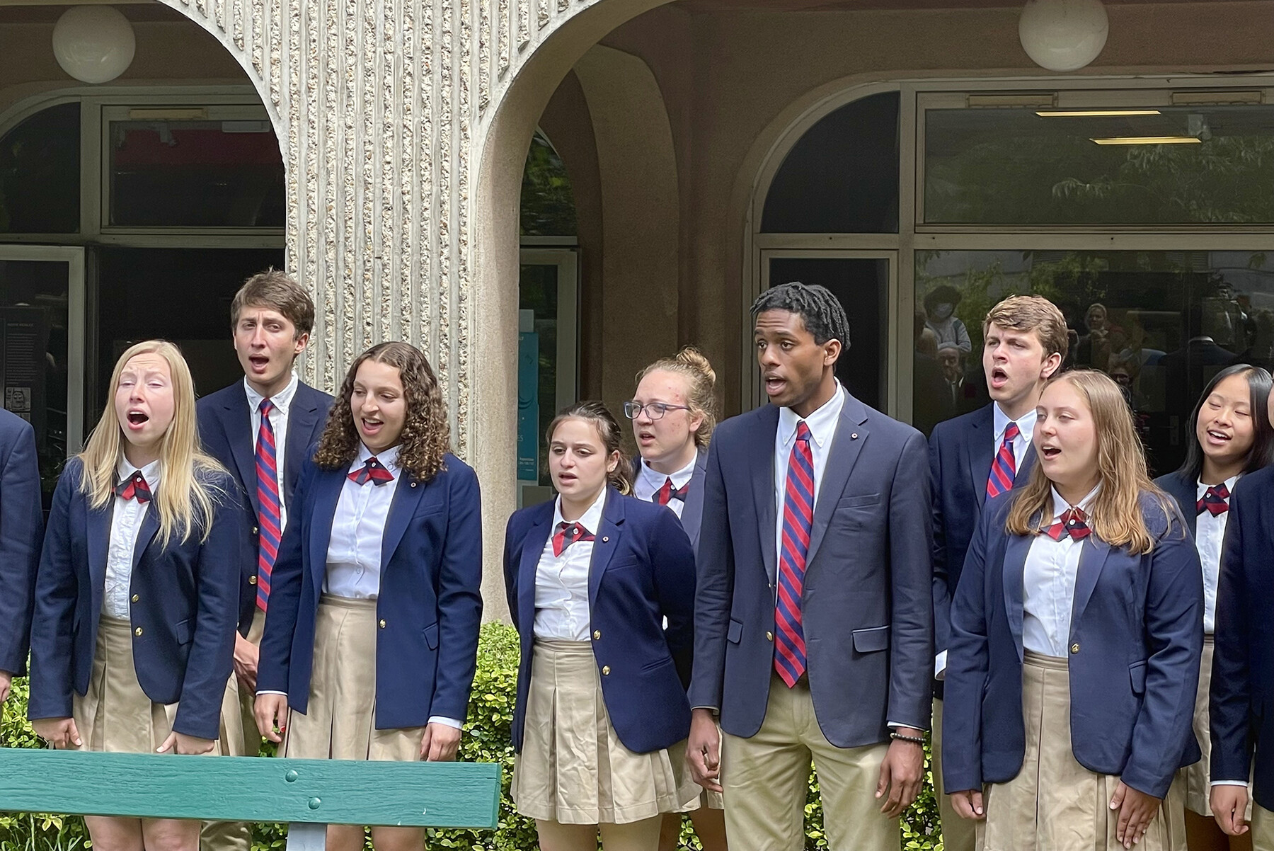The Penn Glee Club performs outside a hospital in Paris.