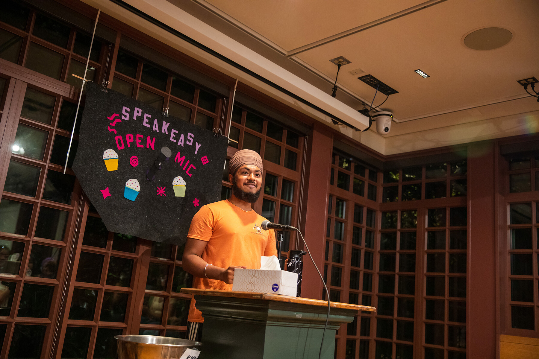 A speaker at the podium at the Kelly Writers House.