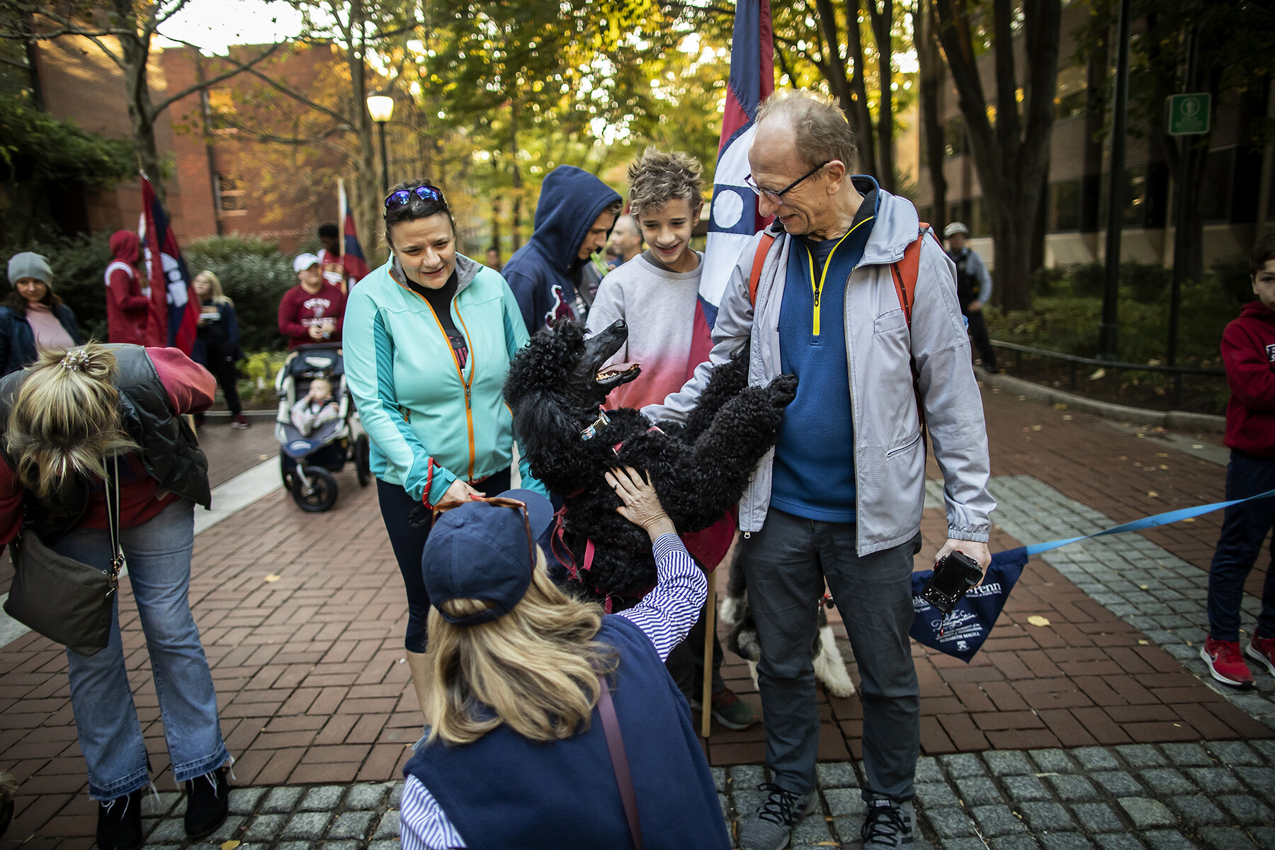 magill on locust walk with a poodle