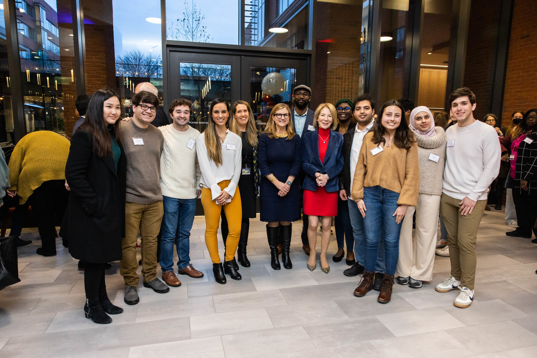 President Magill and Gutmann celebrate with members of the Gutmann College House family.