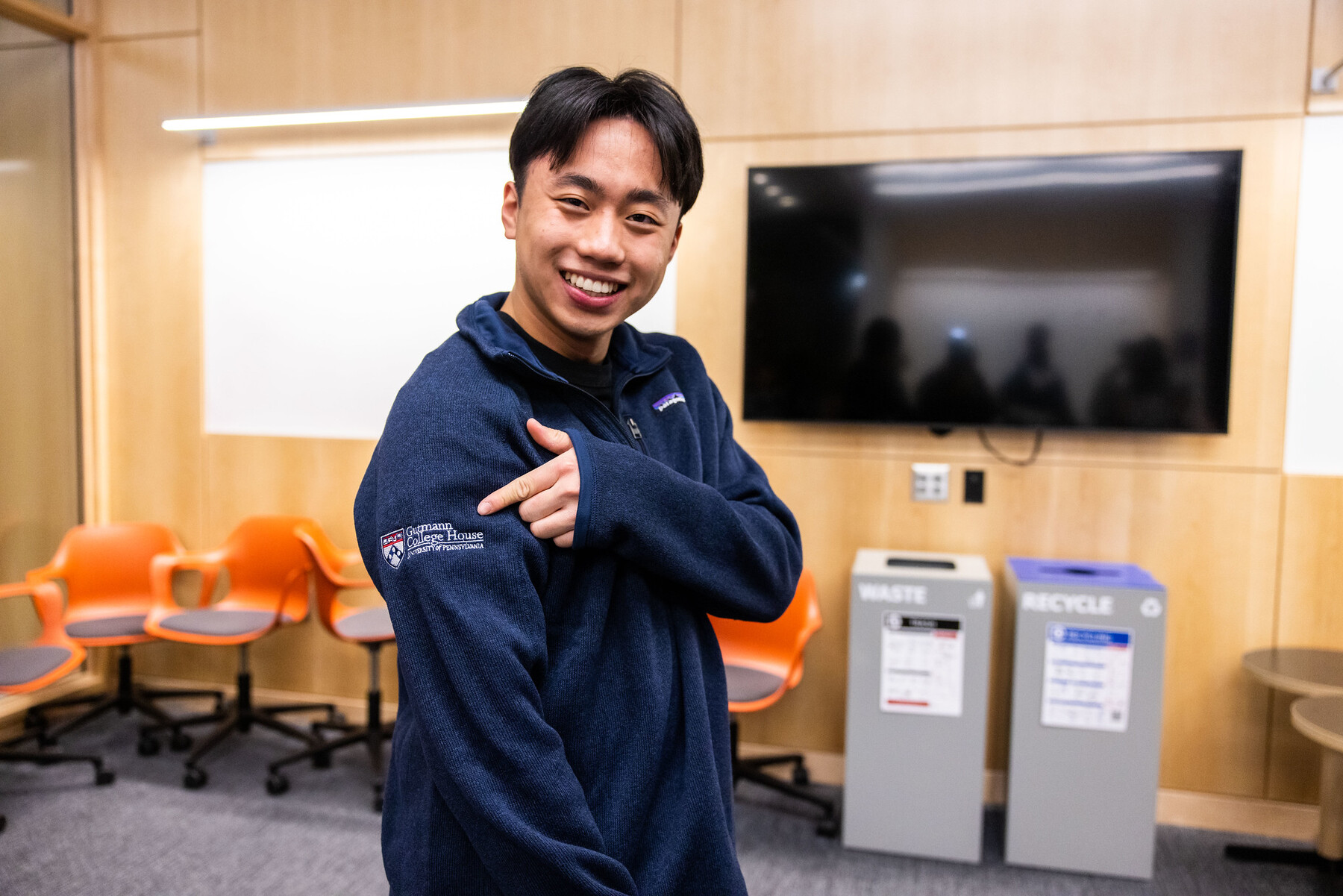 student with custom Gutmann College House jacket