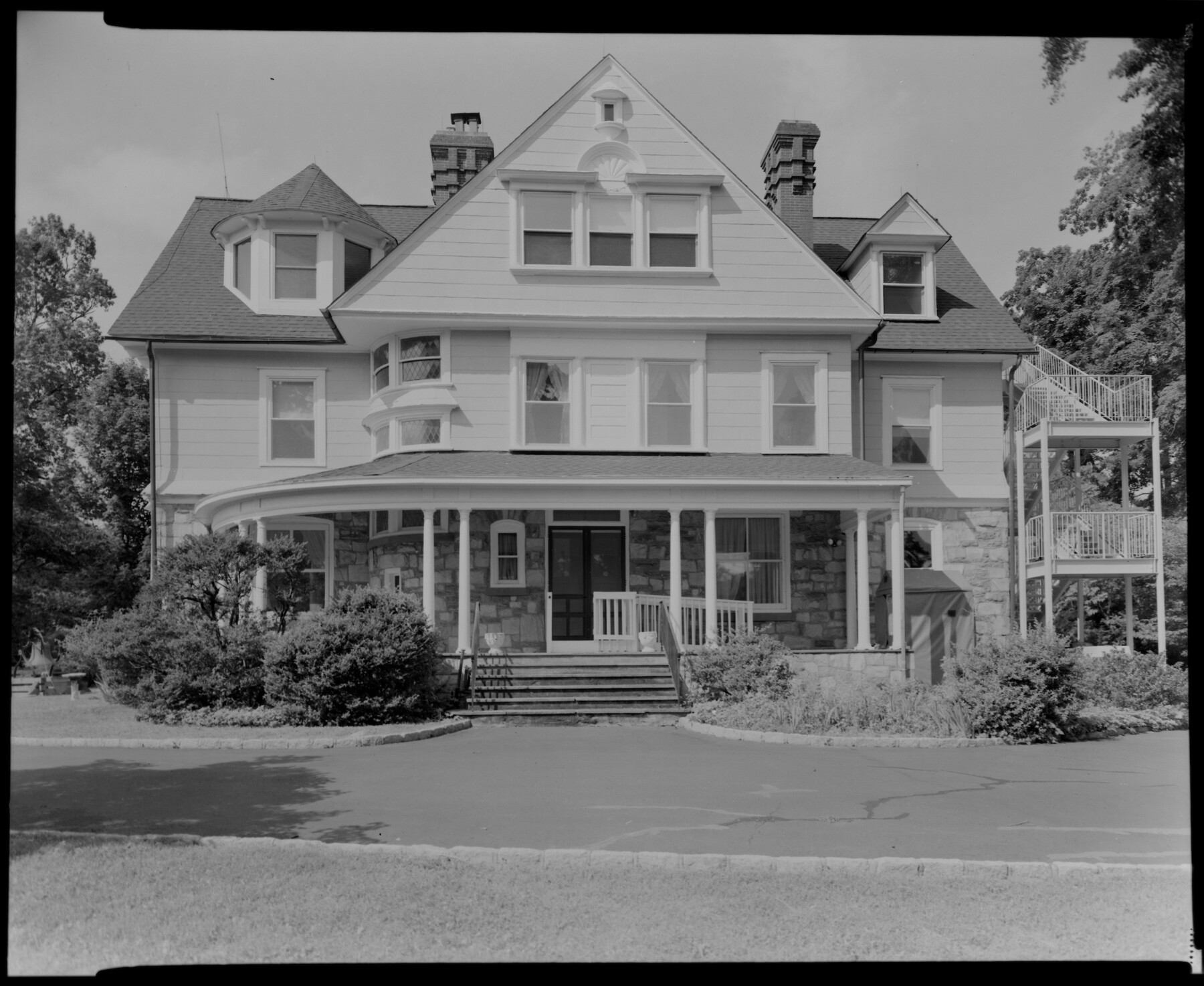 three-story house with a porch