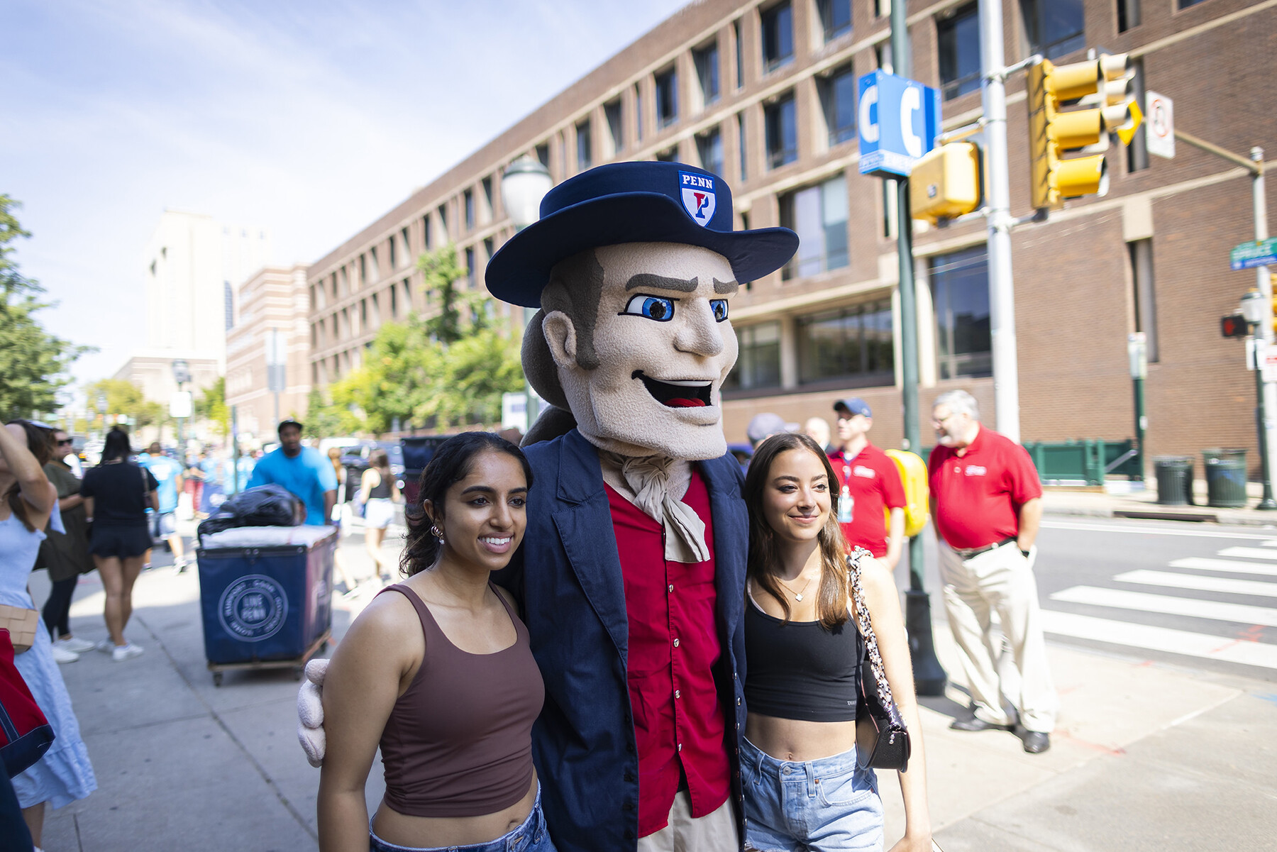 Two students pose with the Penn Quaker
