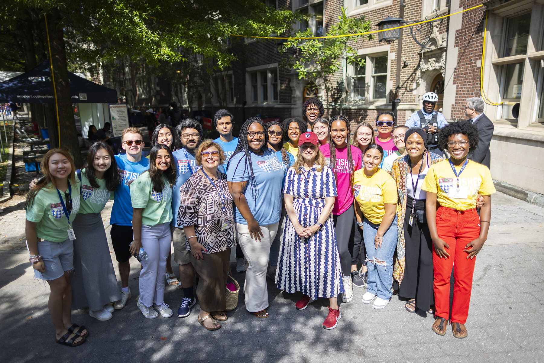 Liz Magill and a group of people posing for the camera on Move-In.
