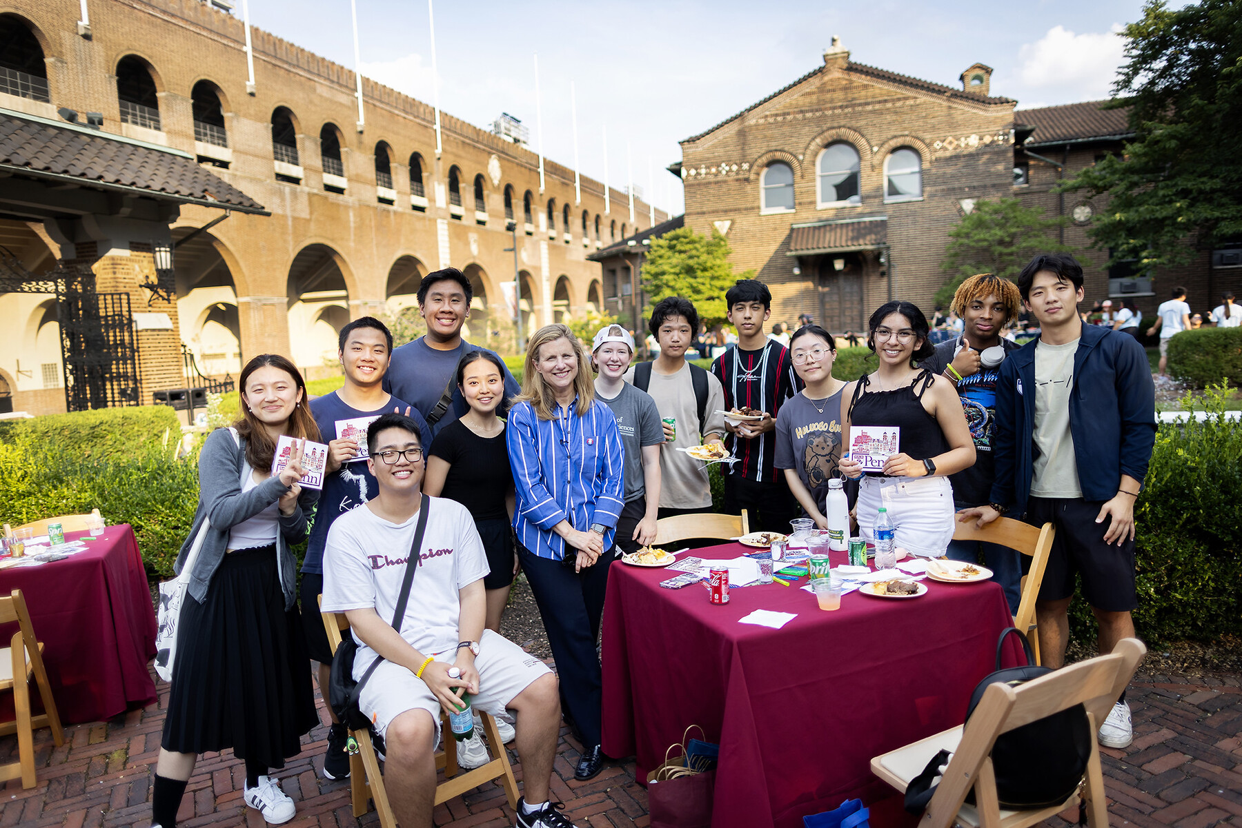 Students smile for a photo with President Liz Magill
