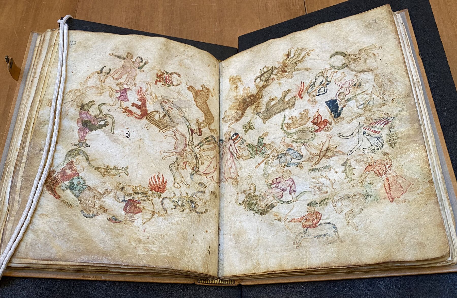 Hand paintings in an ancient text.