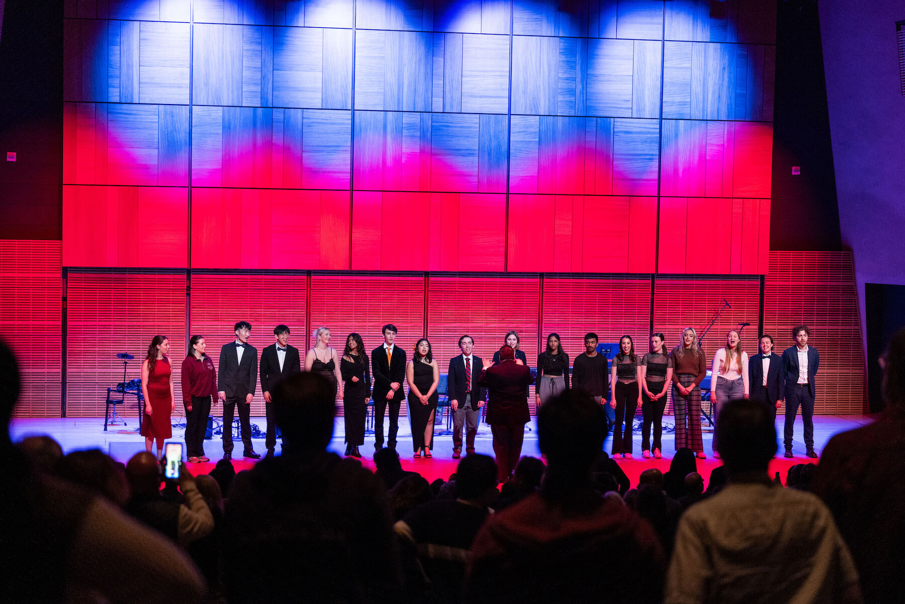 Students from Penn on stage at Carnegie Hall singing “The Red and the Blue.”