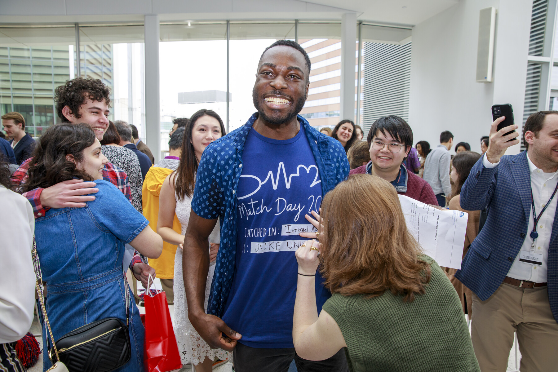 A Penn Med student has their shirt written on on Penn Med’s Match Day.