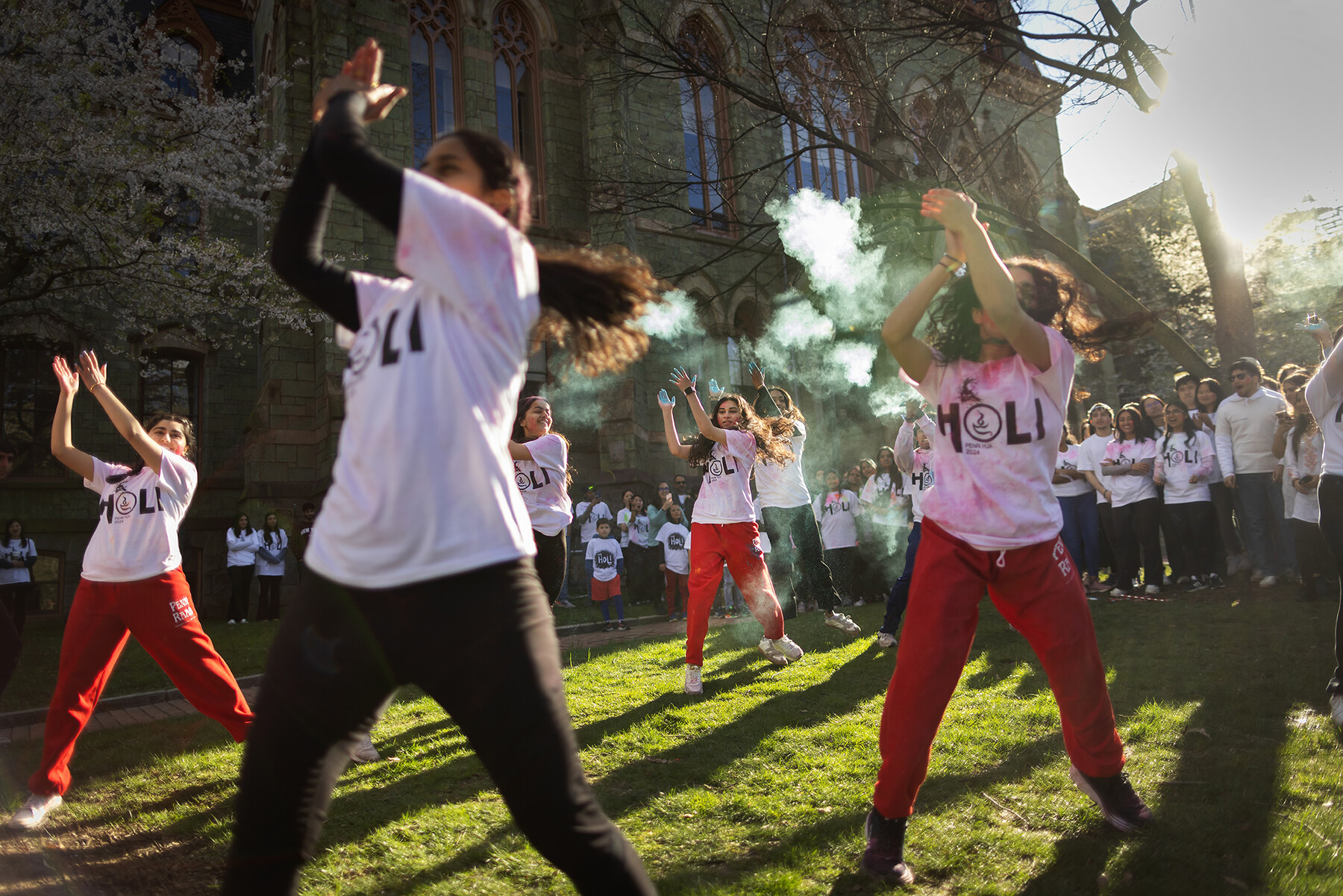 Holi performers dancing on College Green during Penn’s Holi celebration.