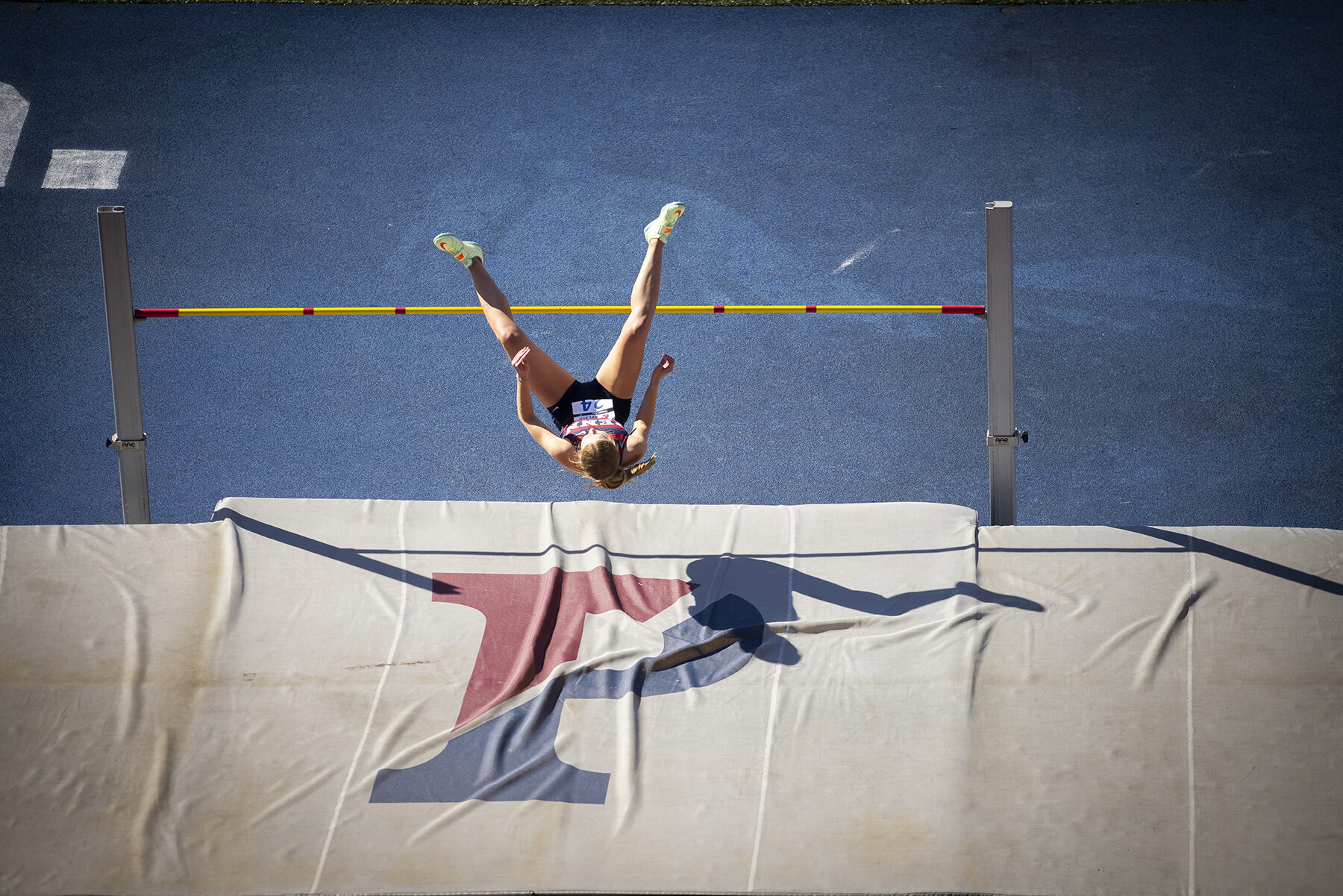 student athlete competes in the high jump during the penn relays