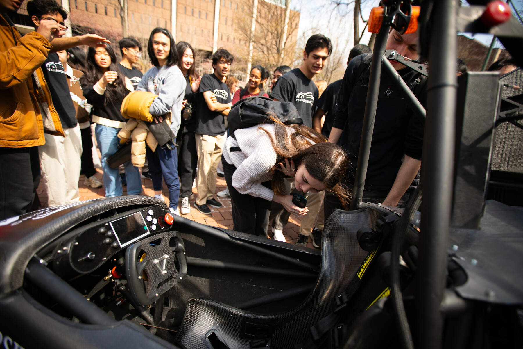 Students inpect REVX's cockpit