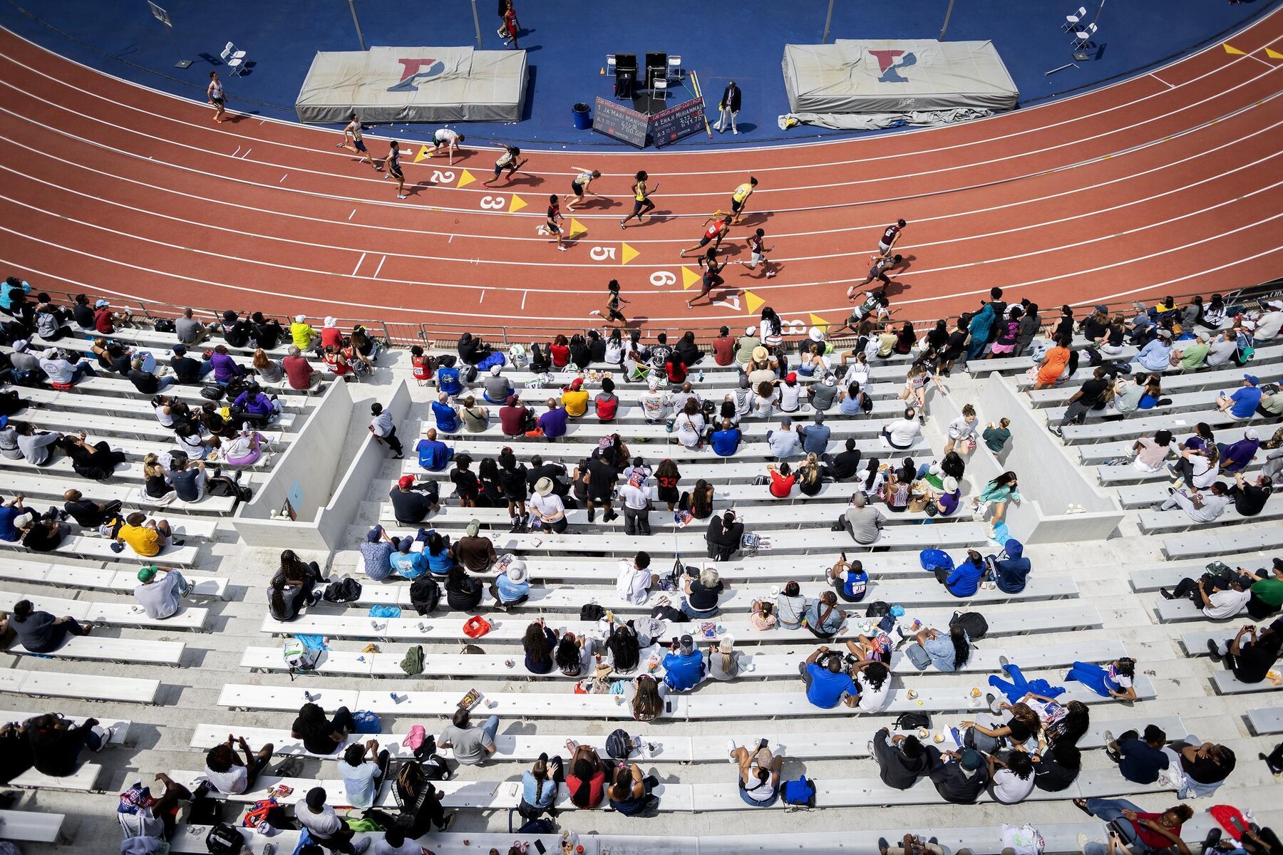 Aerial view of runners on Franklin Field at the Penn Relays.