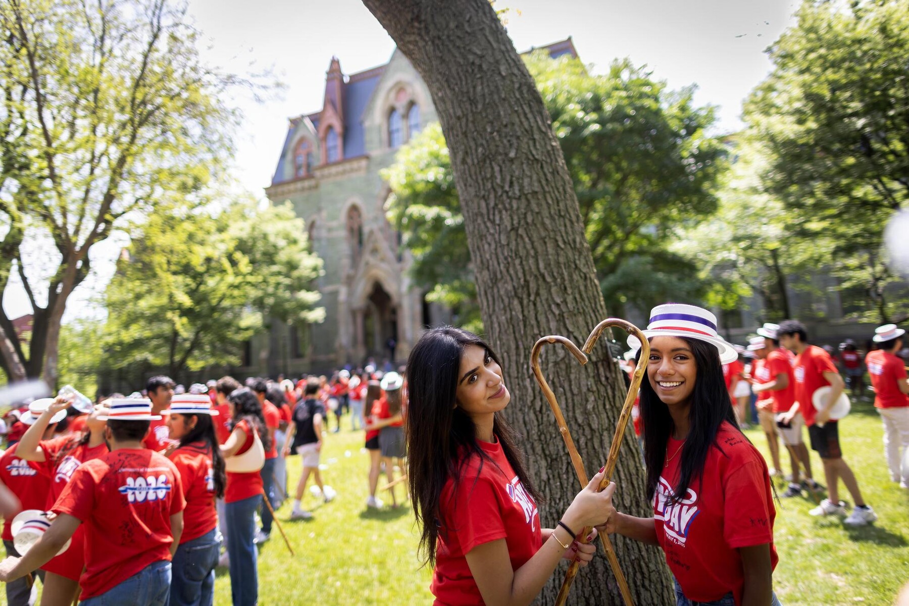 Students holding their Hey Day canes on College Green.