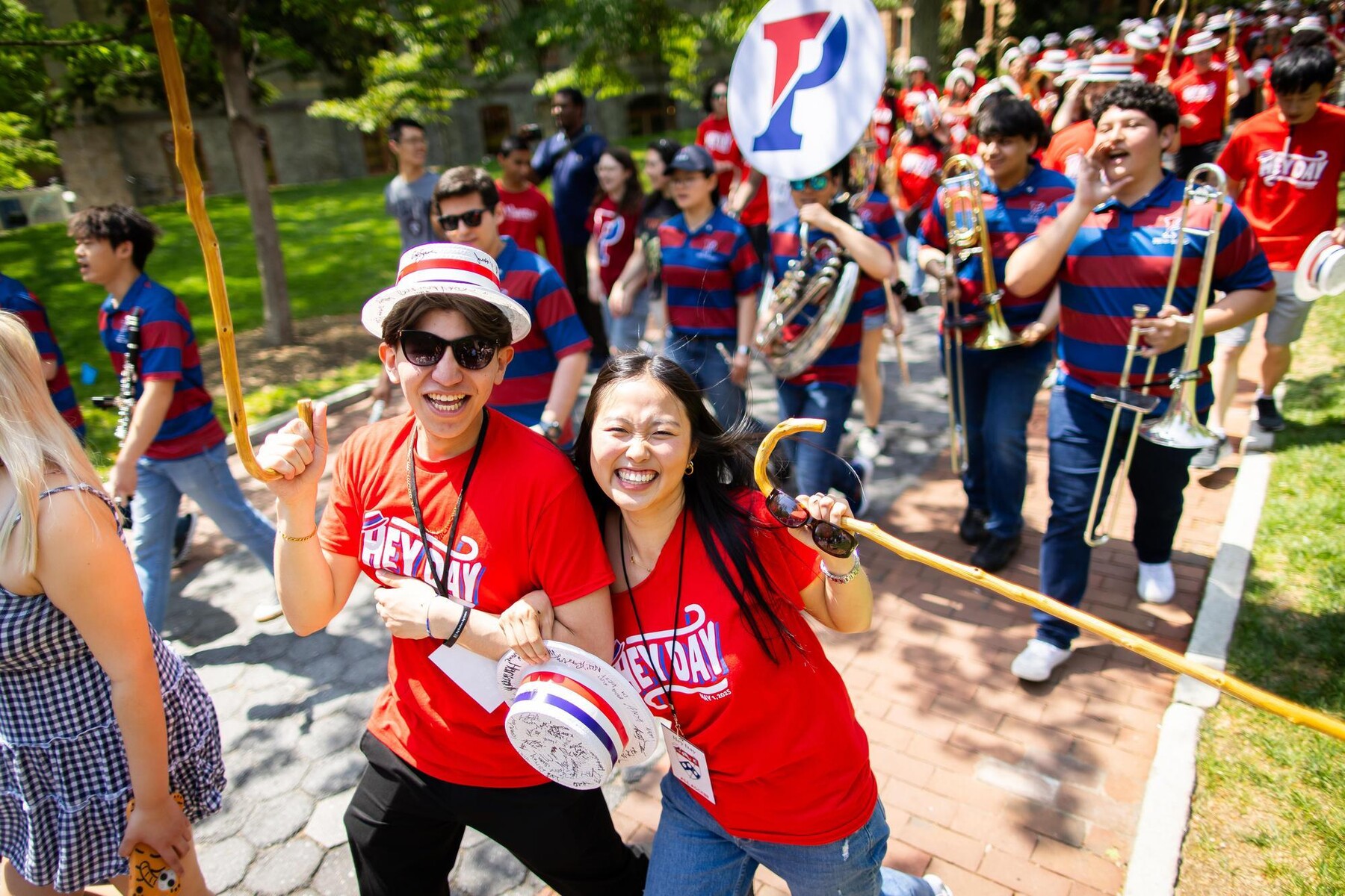 Students walking in the Hey Day procession along Locust Walk.
