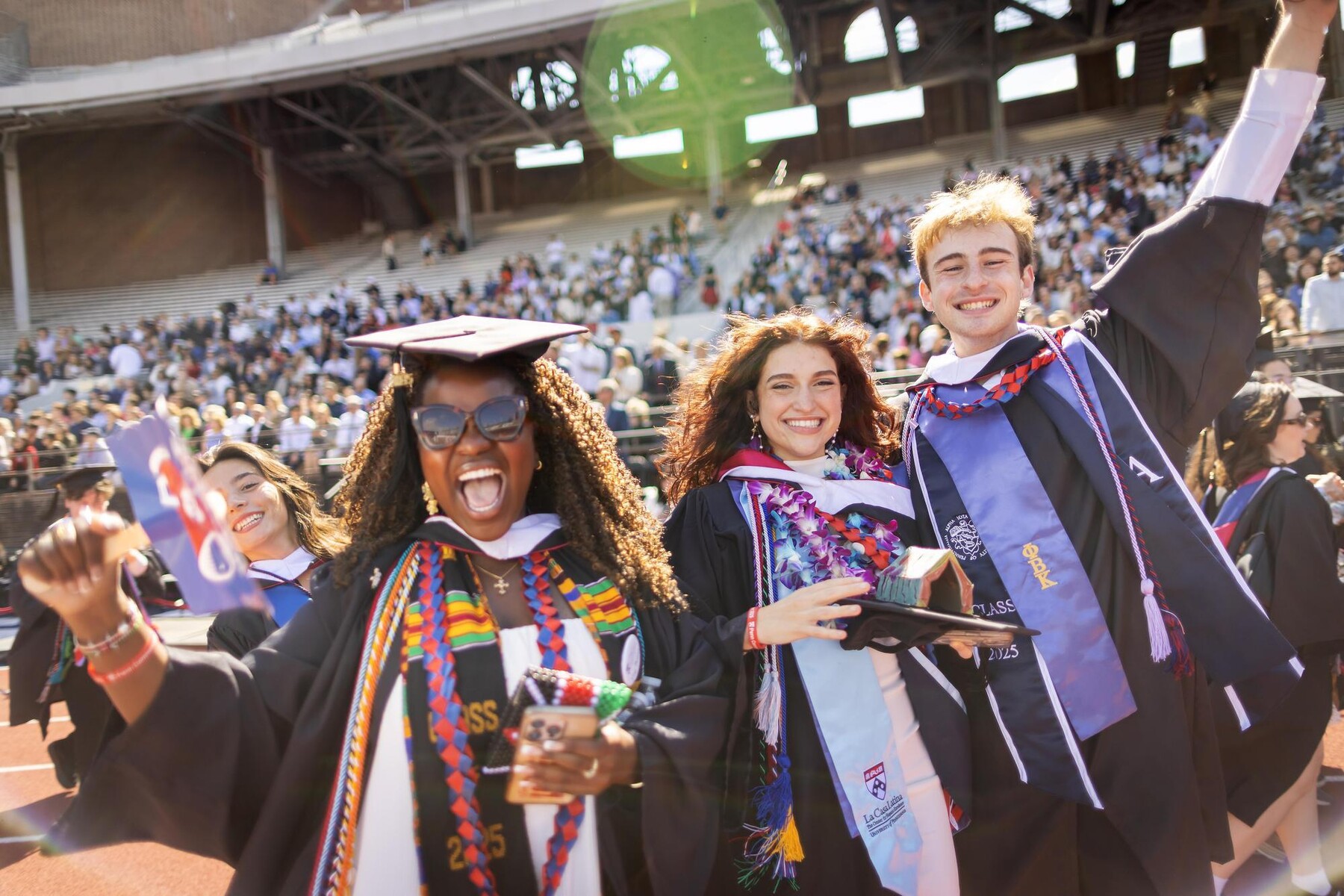 Students celebrating at Penn’s 269th Commencement at Franklin Field.