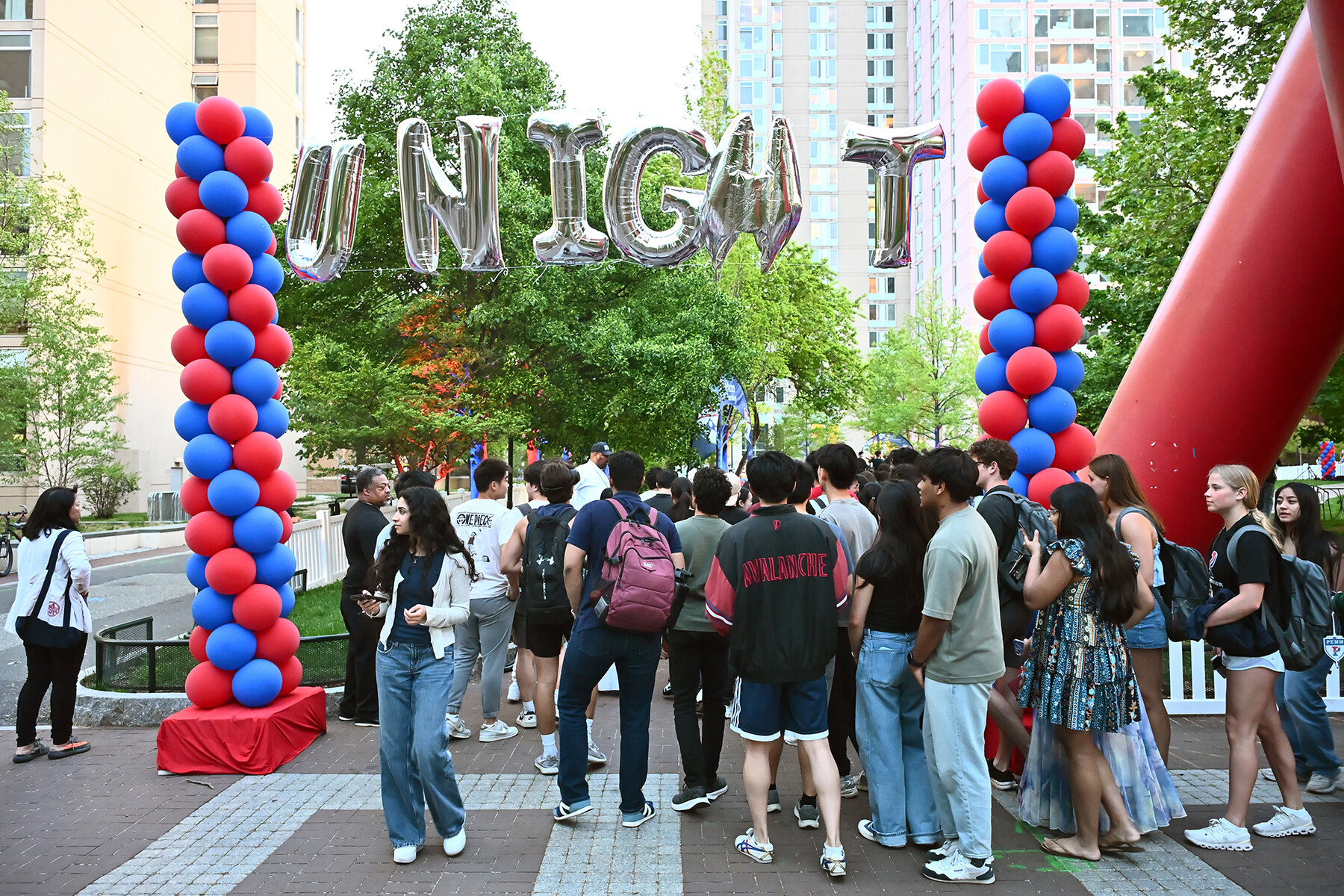 Students in line to enter the U-Night celebration on Penn’s campus with balloons at the entrance.