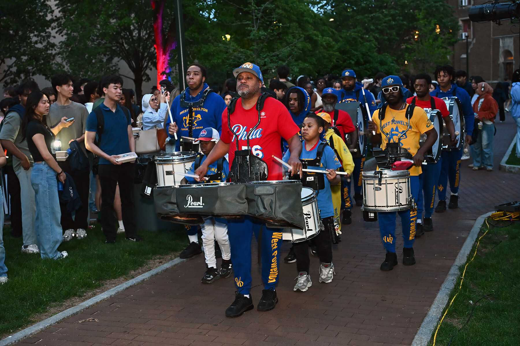 Members of a marching band perform on Penn’s campus for U-Night.