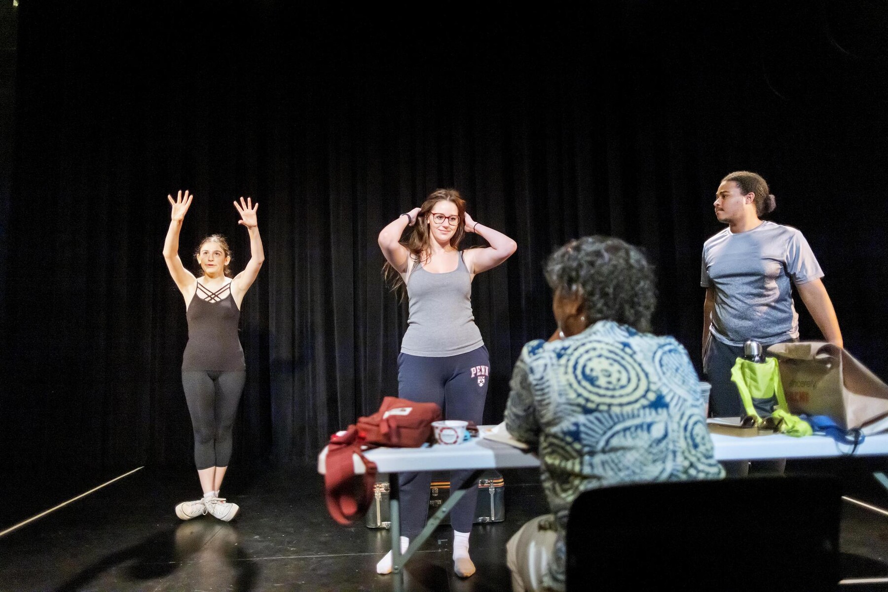 Margit Edwards watches Anya Rothman, Pandora Schoen, and Elliot Ross-Dick rehearsing.