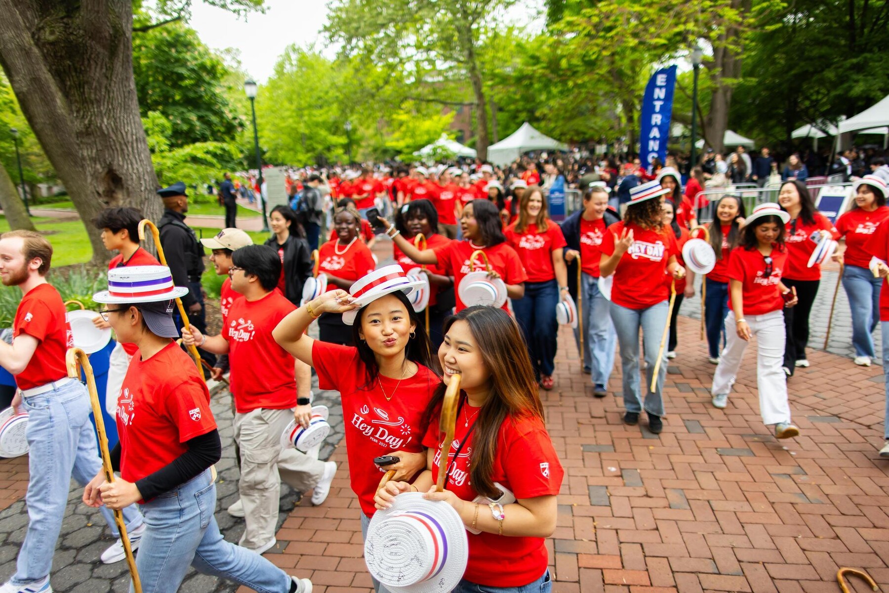 Class of 2027 students walking on Locust Walk during Hey Day.