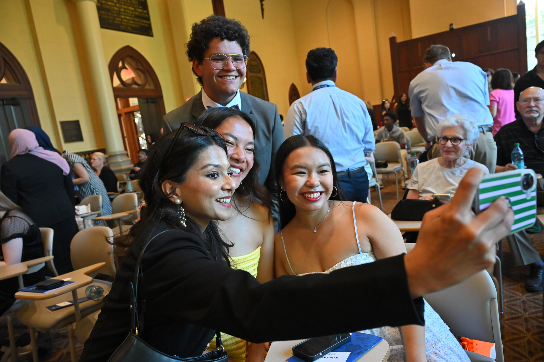 Students taking a selfie at Ivy Day ceremony 2026.