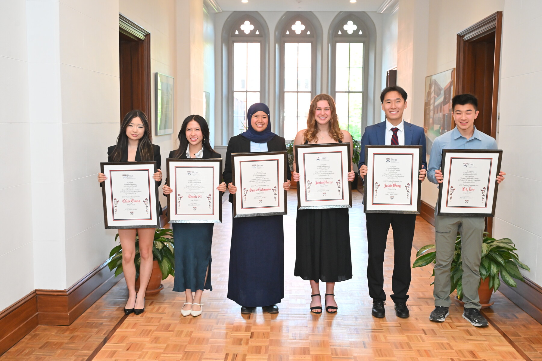 The recipients of the President’s Prizes holding framed certificates.
