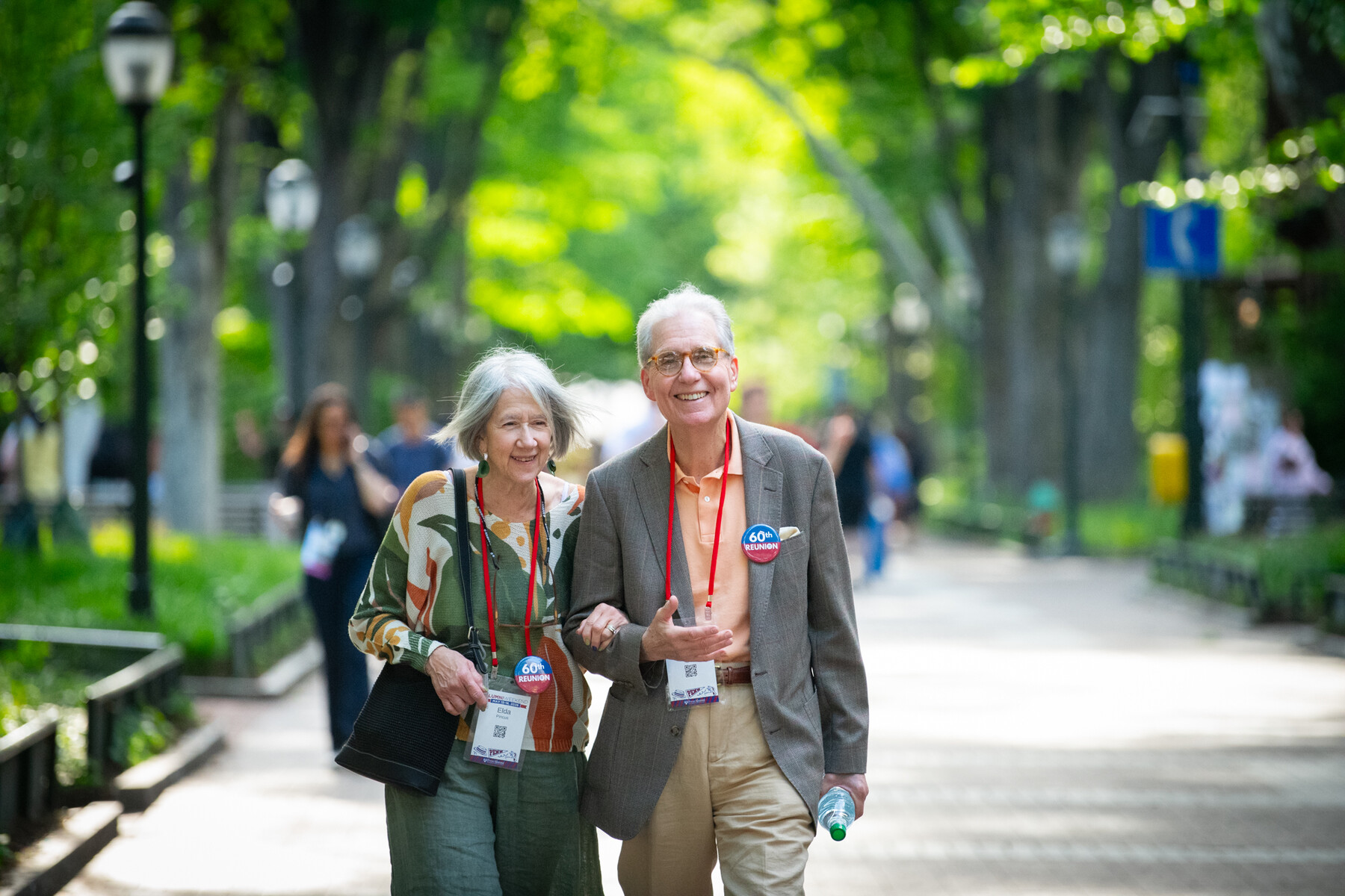 Two Penn alums walking down Locust Walk.
