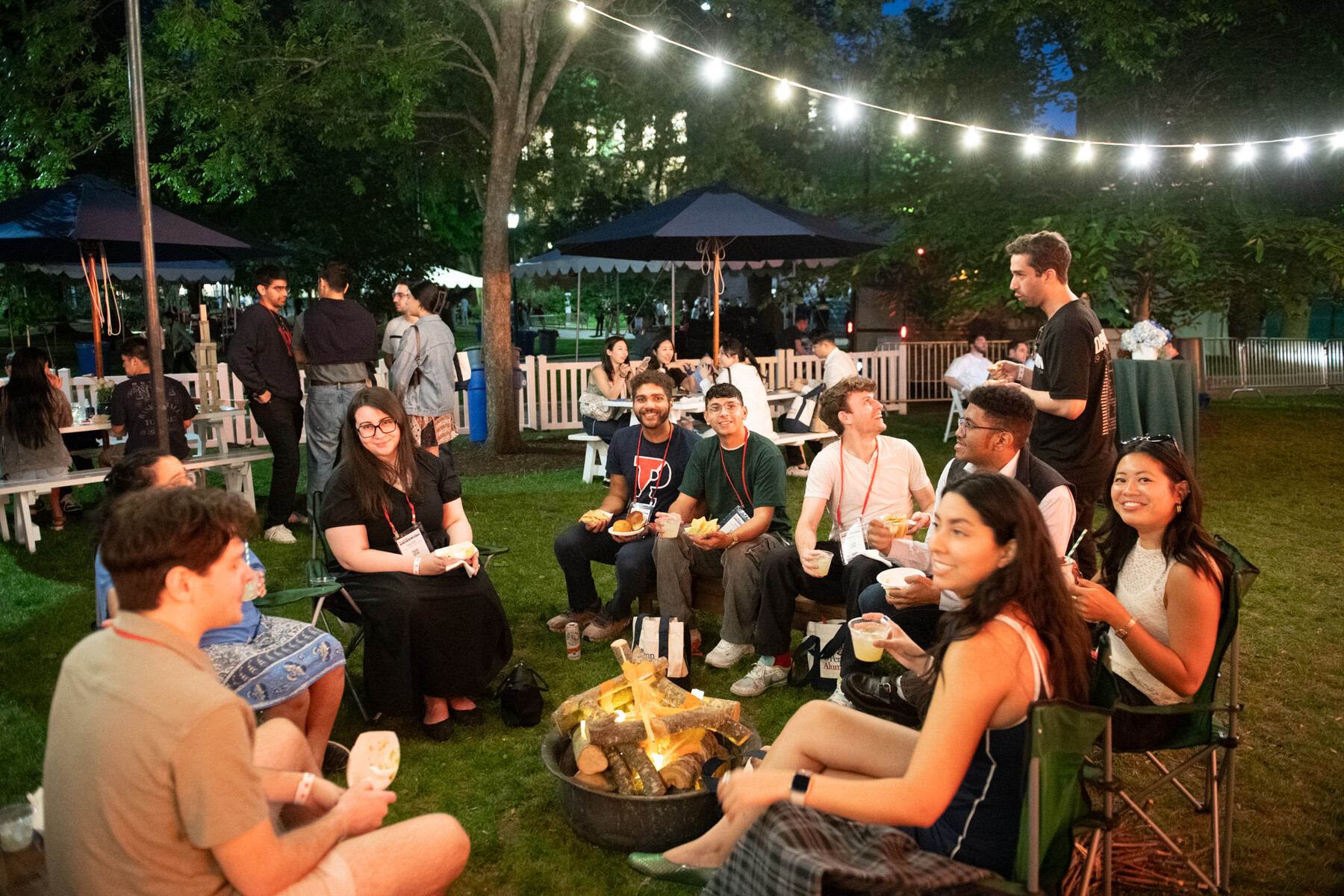 Penn alums at a campfire during Alumni weekend.