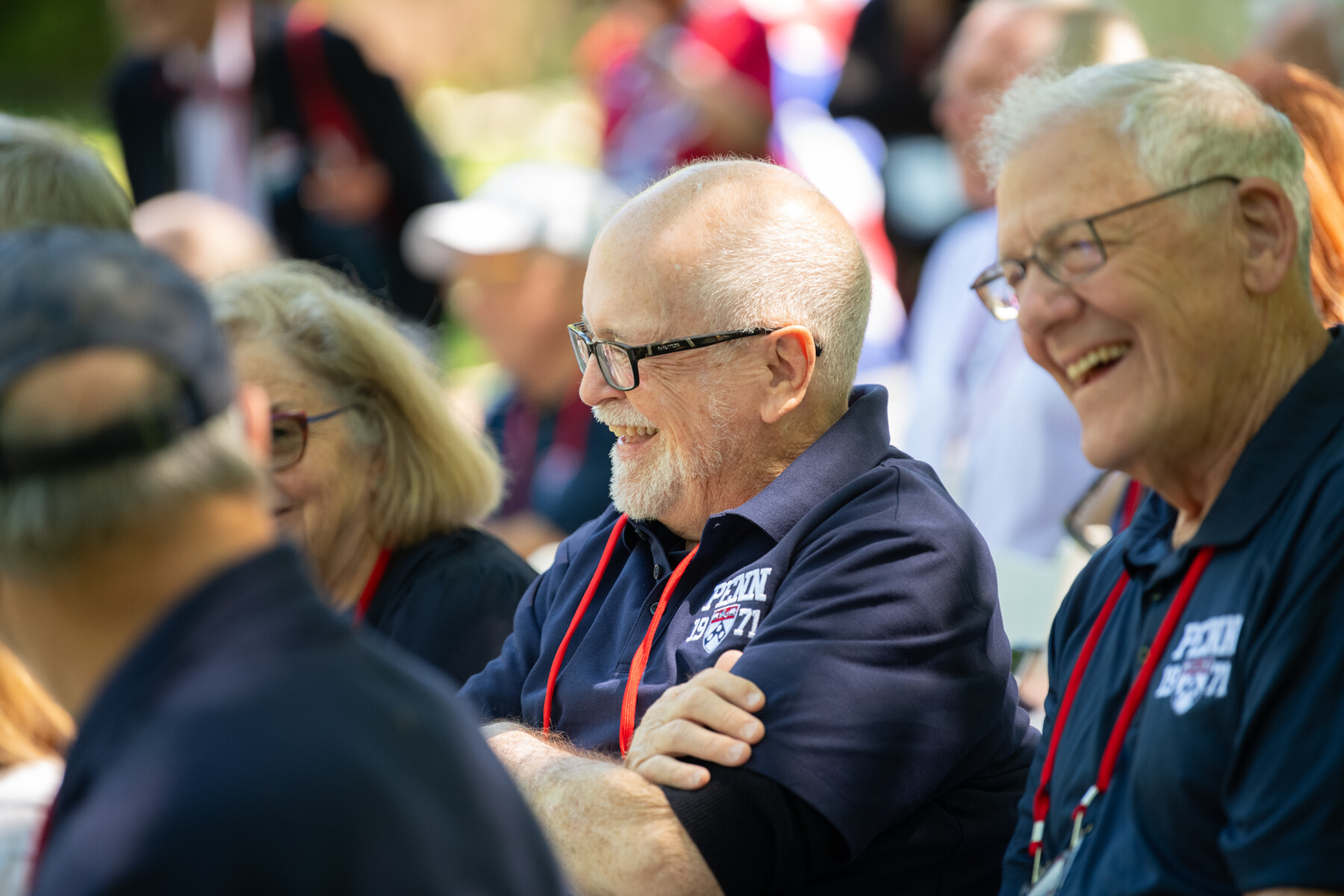 People laughing at penn’s alumni weekend.