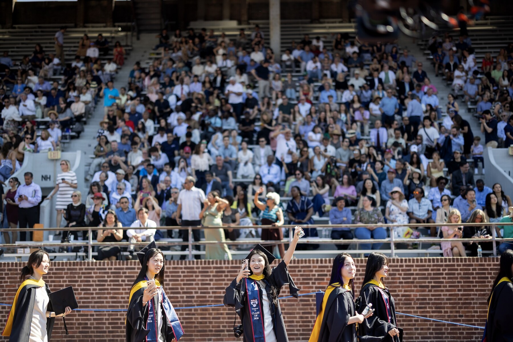 Students walking onto Franklin field for commencement