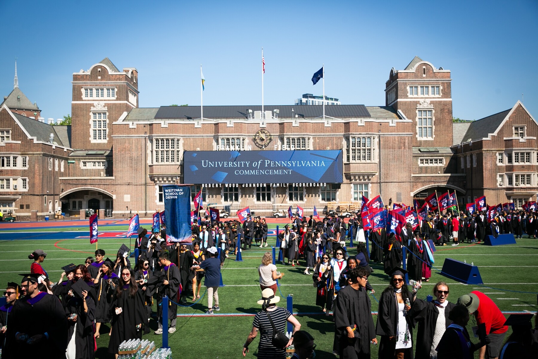 Students walking onto Franklin Field for commencement.