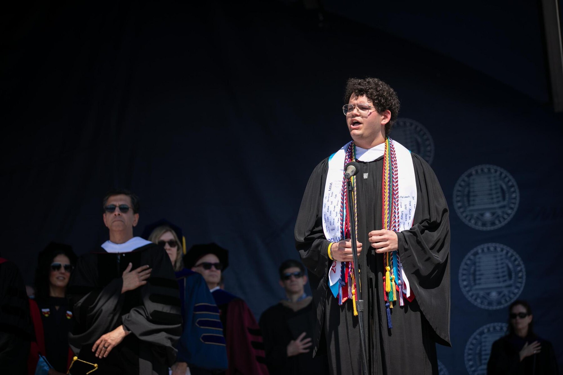 Noah Milaud speaking at commencement.