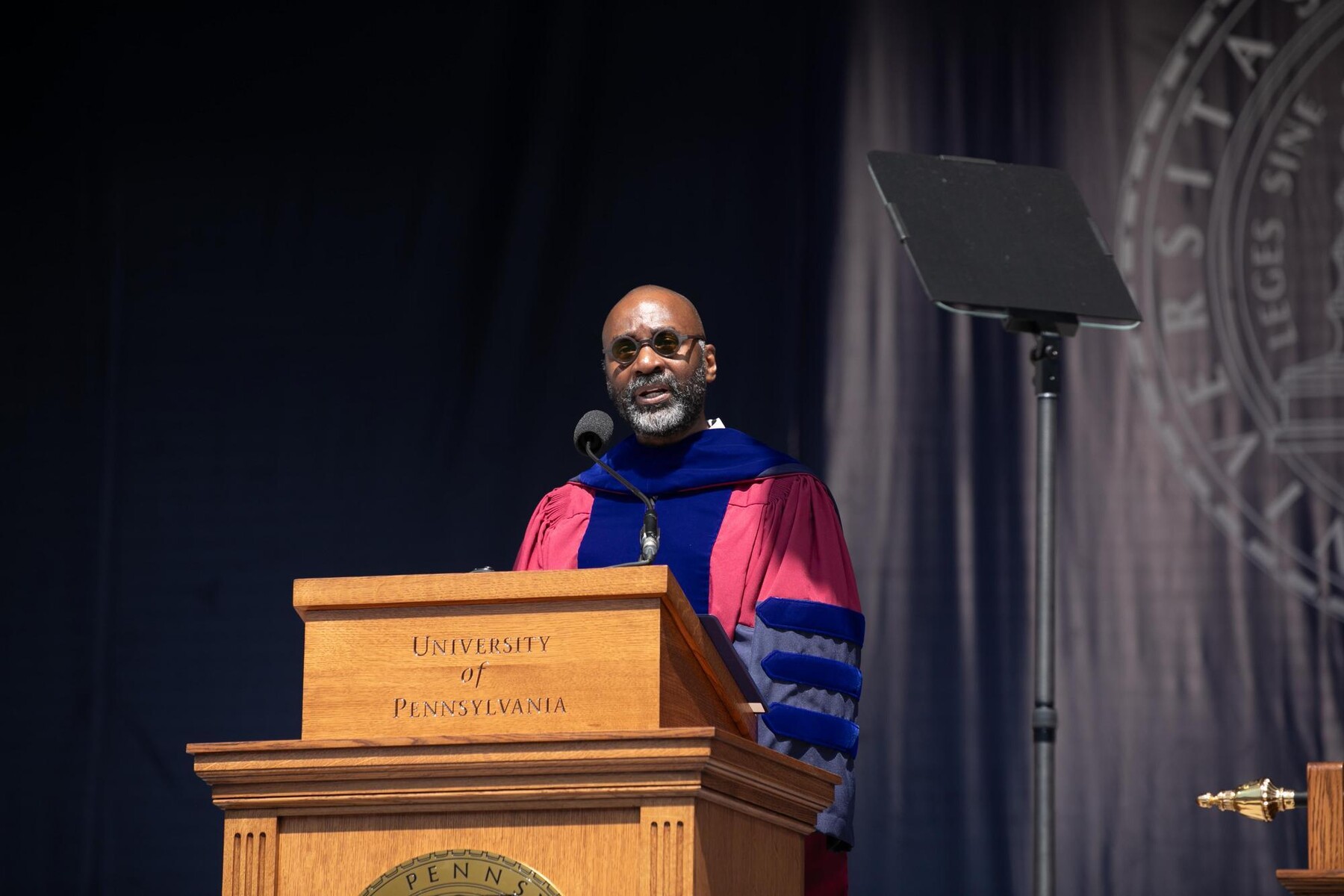 Provost John L. Jackson Jr. at the podium during commencement.