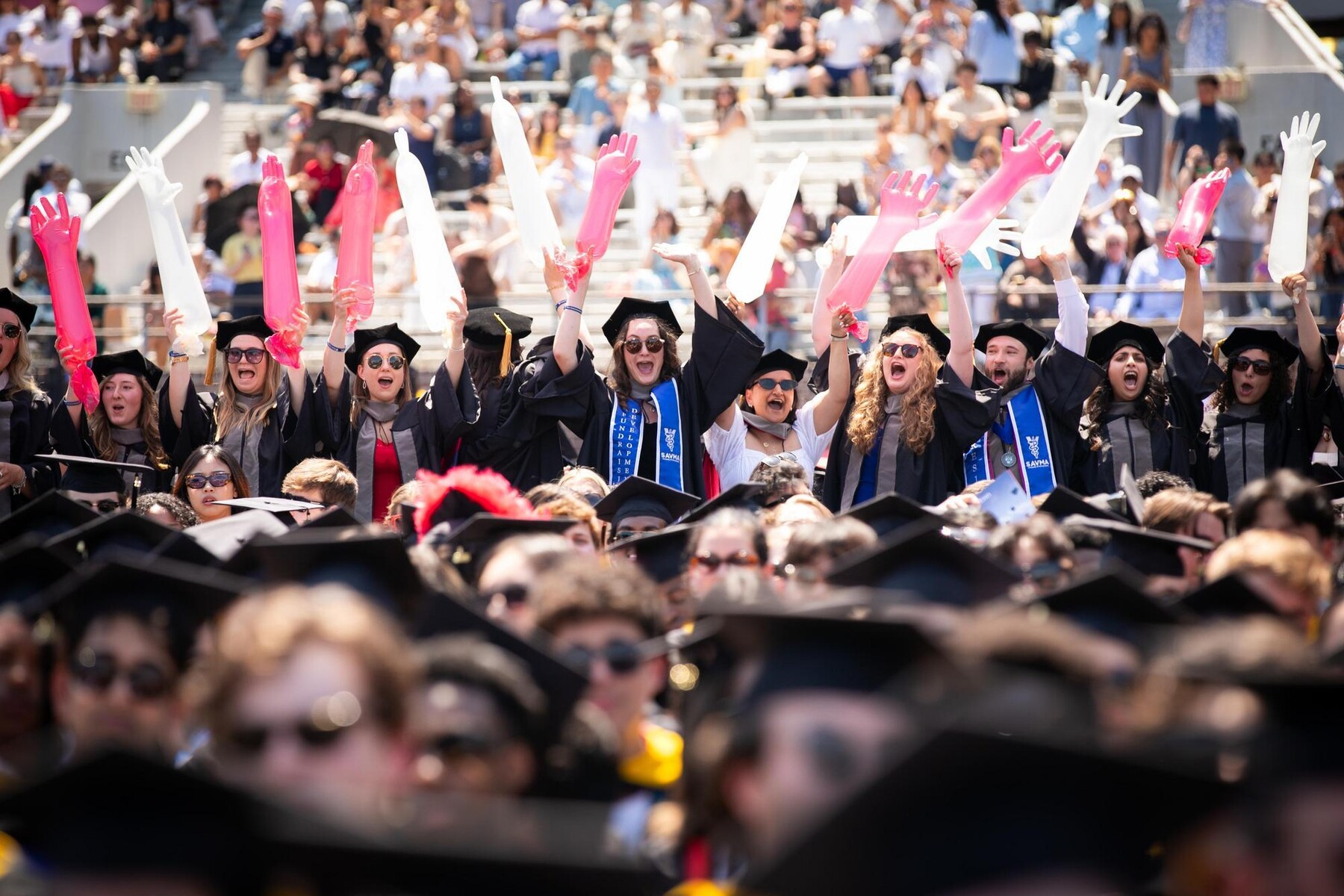 Penn graduates on Franklin Field during Commencement.