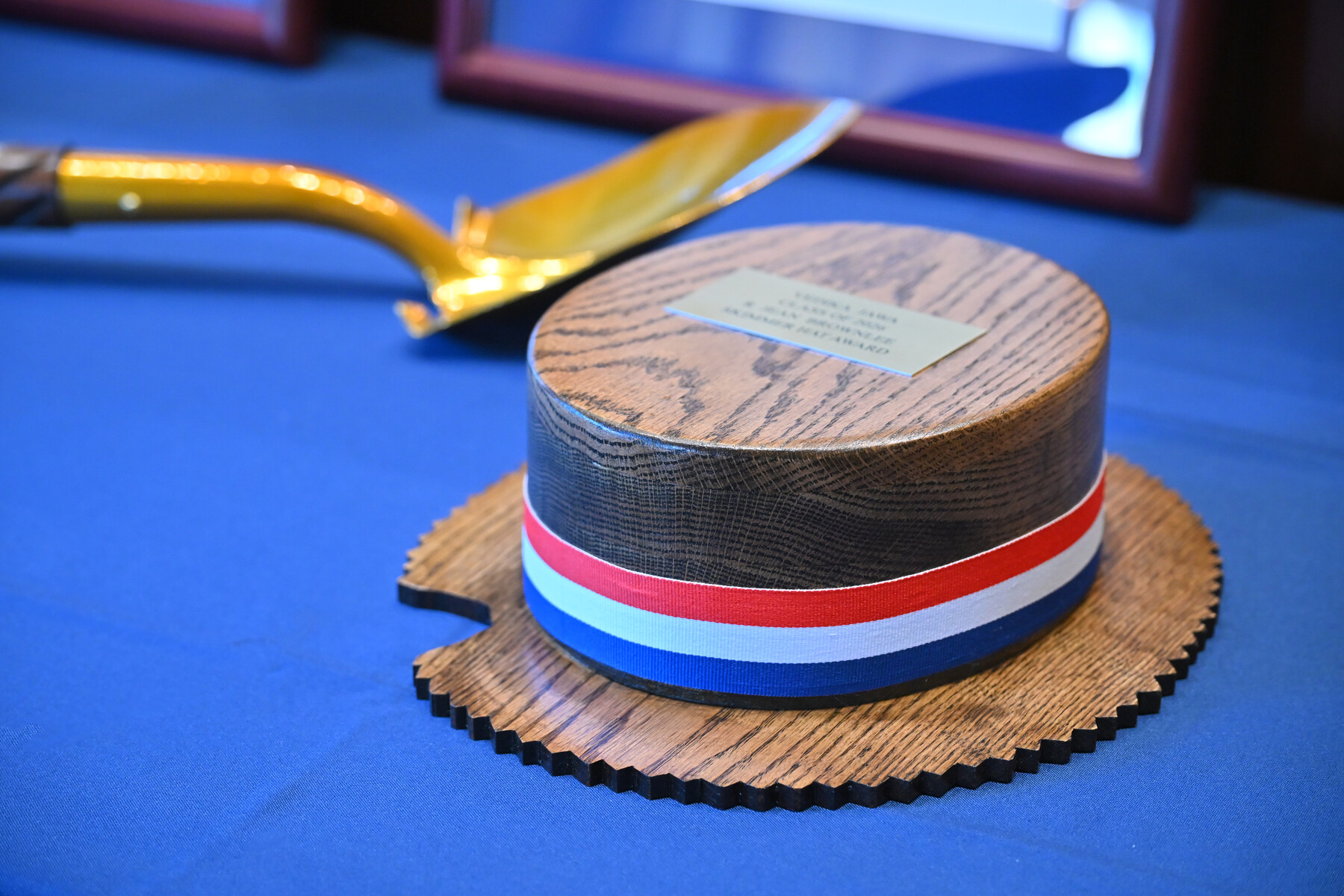 The ceremonial hat and spade on a table.
