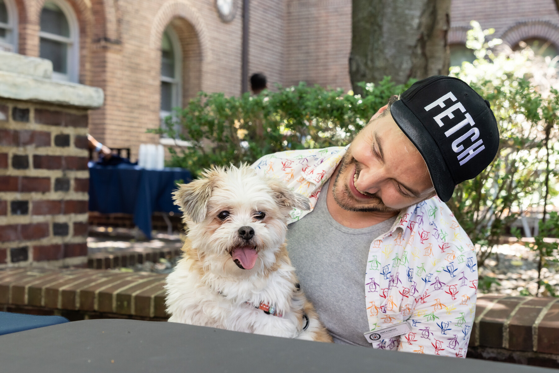 A dog and its human outside the penn museum.